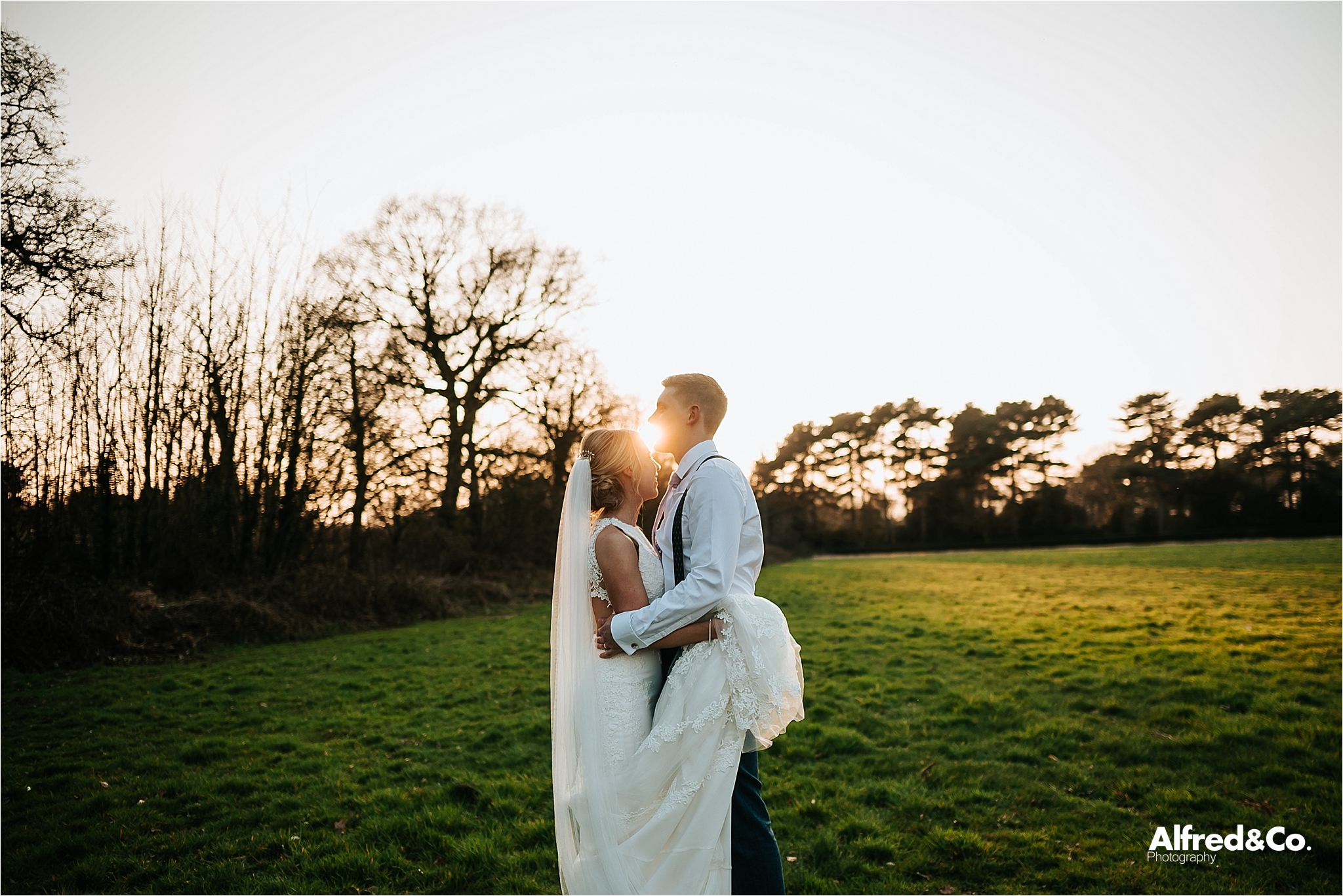 bride and groom at sunset