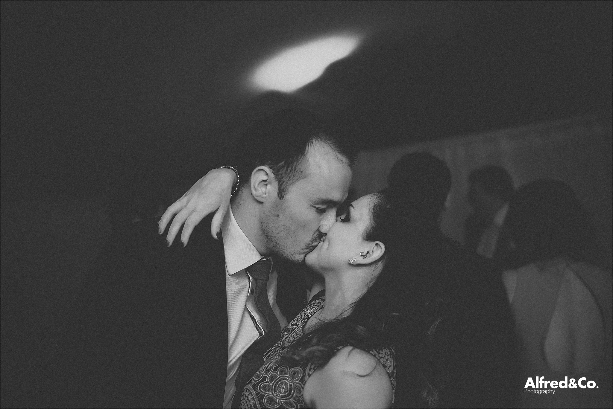 couple kiss at wedding