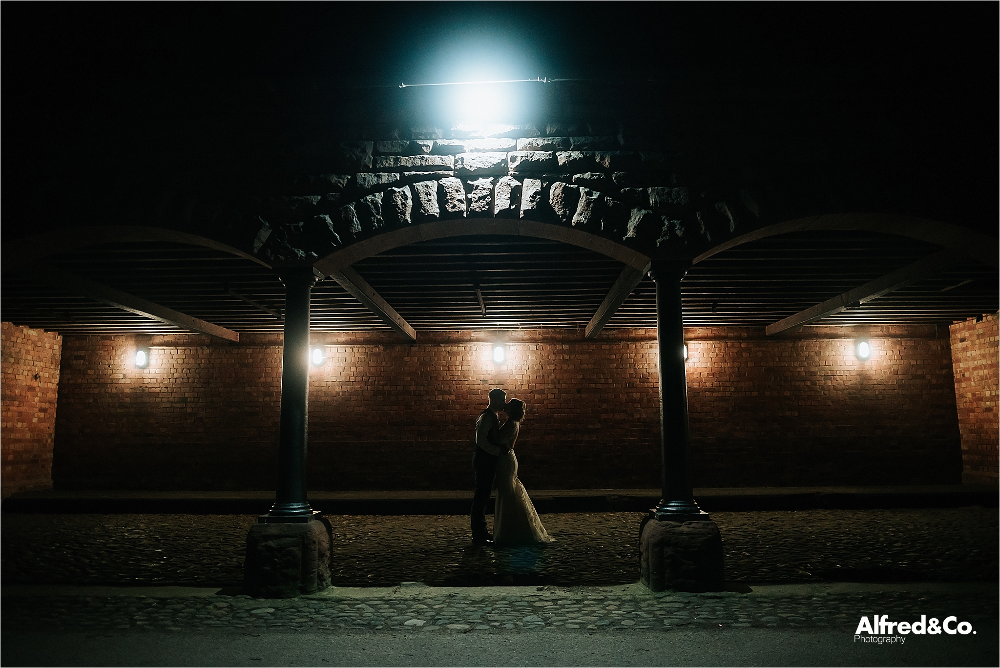 night time shot of bride and groom at speke hall
