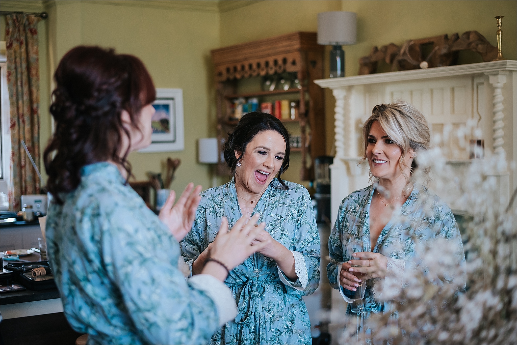 bridesmaids laugh before wedding 