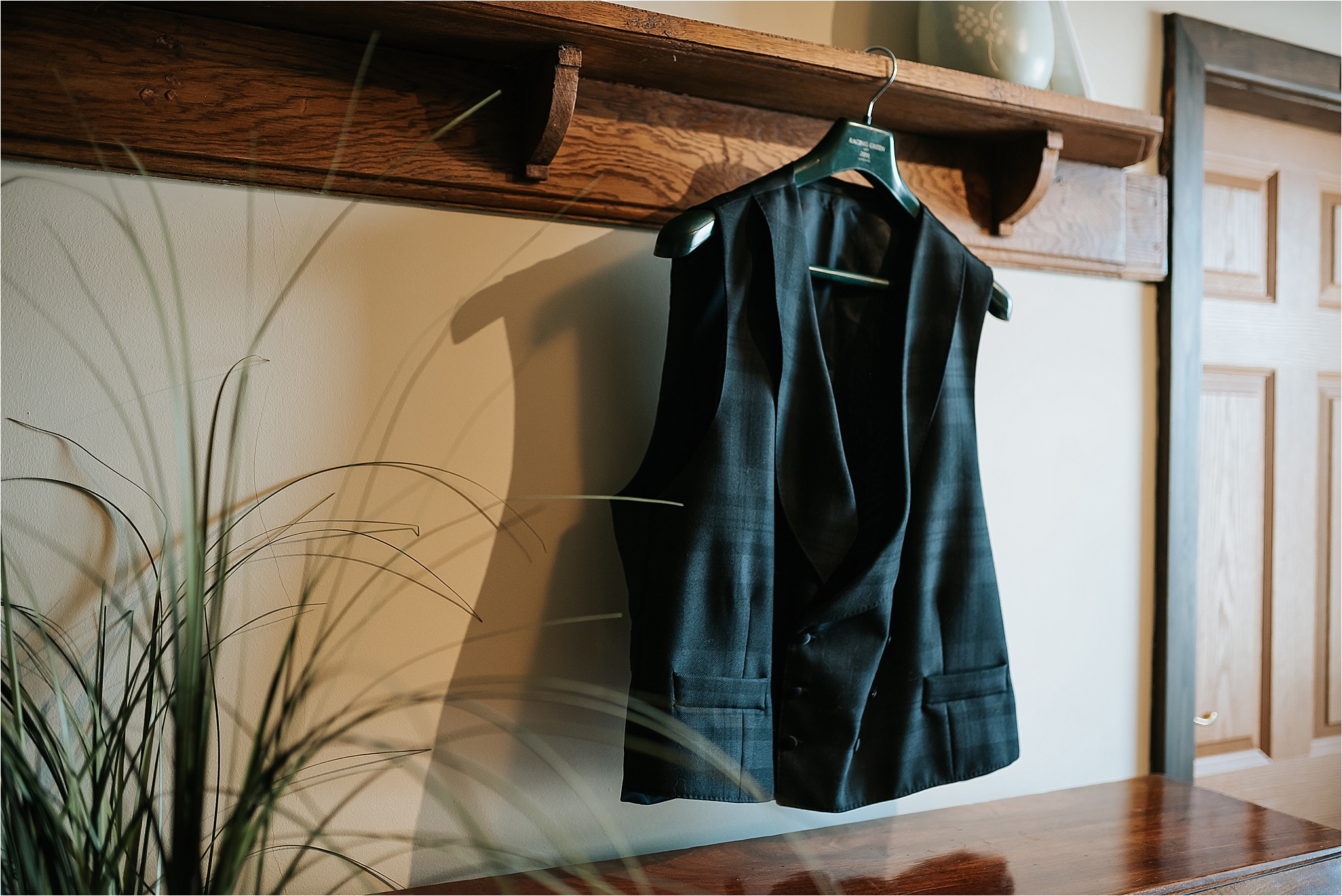 mans waistcoat hanging on picture rail