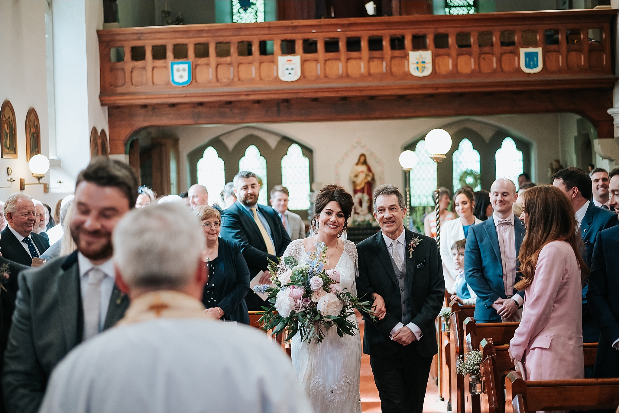 bride walks up the aisle at st marys and st james church scorton 
