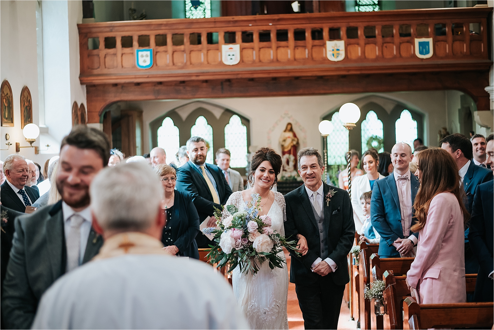 bride walks up the aisle at st marys and st james church scorton