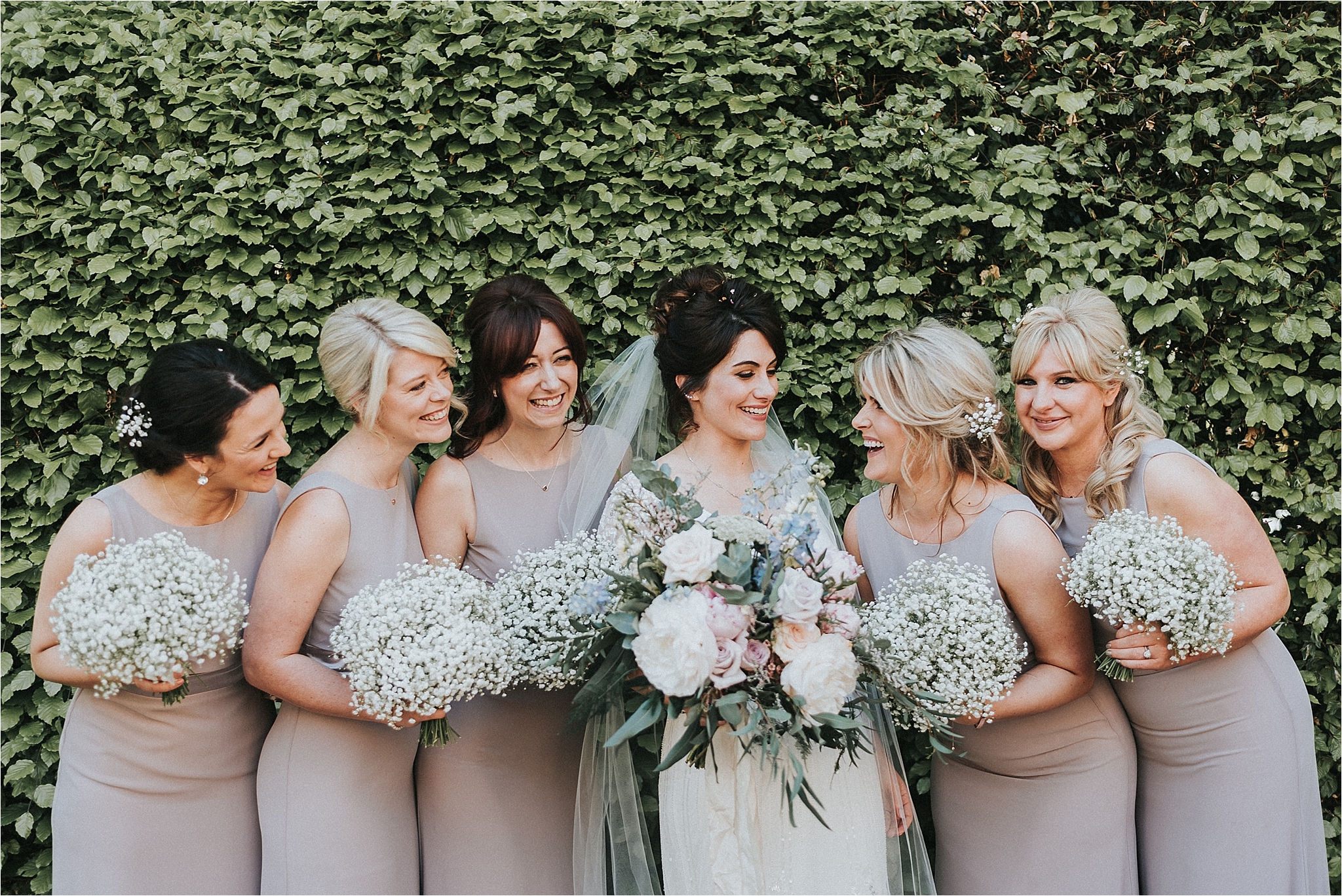 bride and bridesmaids outside church 