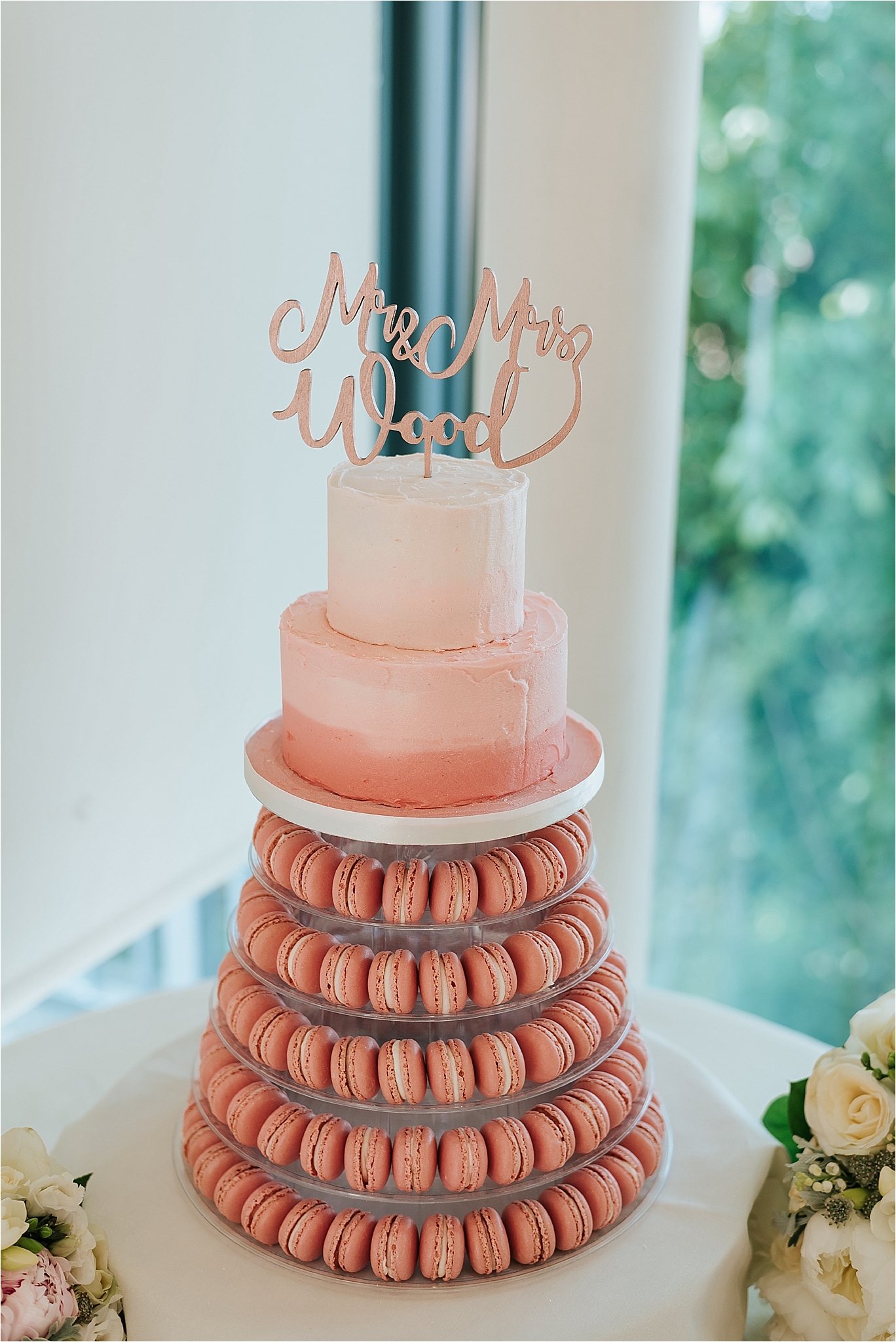 pink and gold cake made from macaroons 
