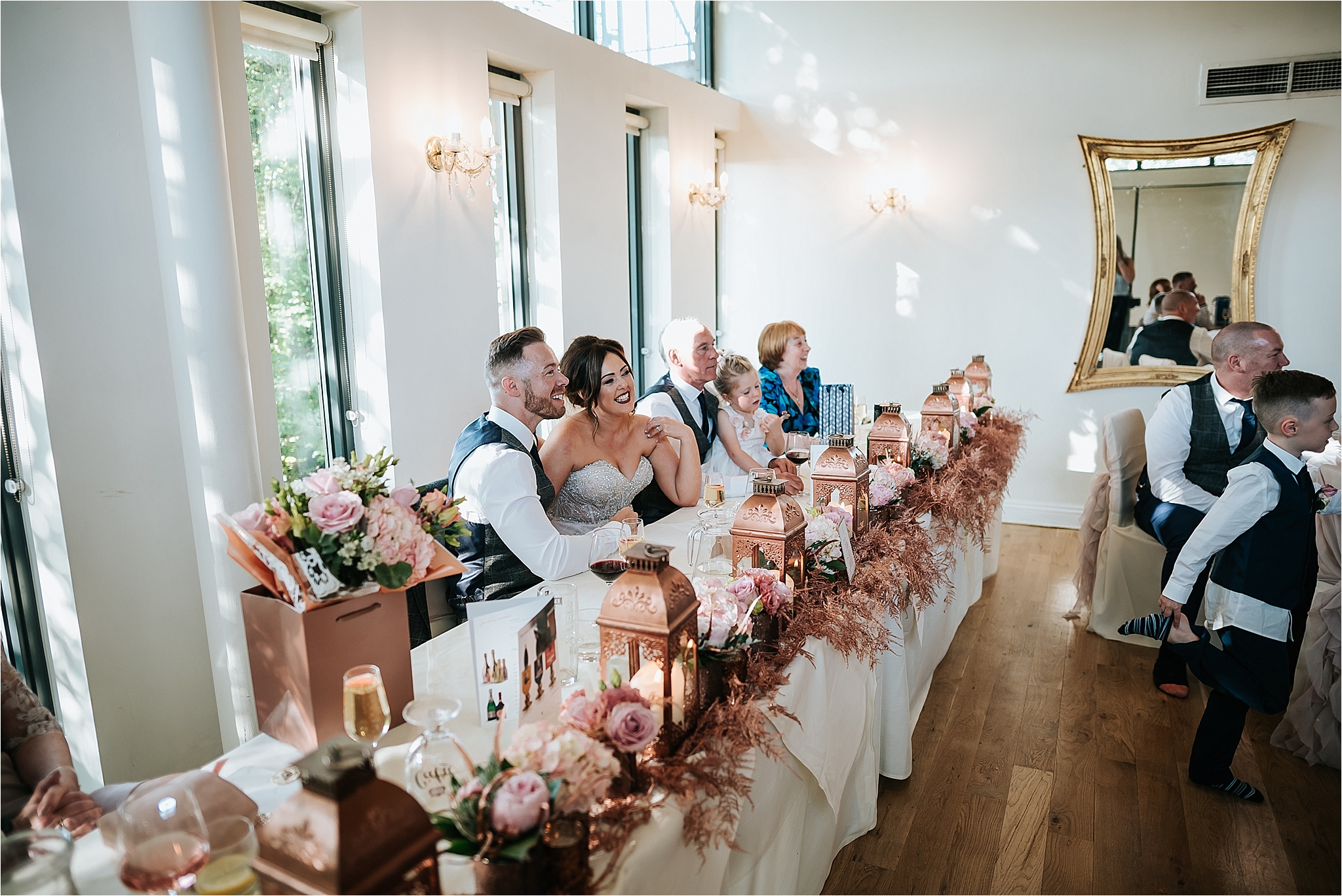 bride and groom in wedding breakfast room 