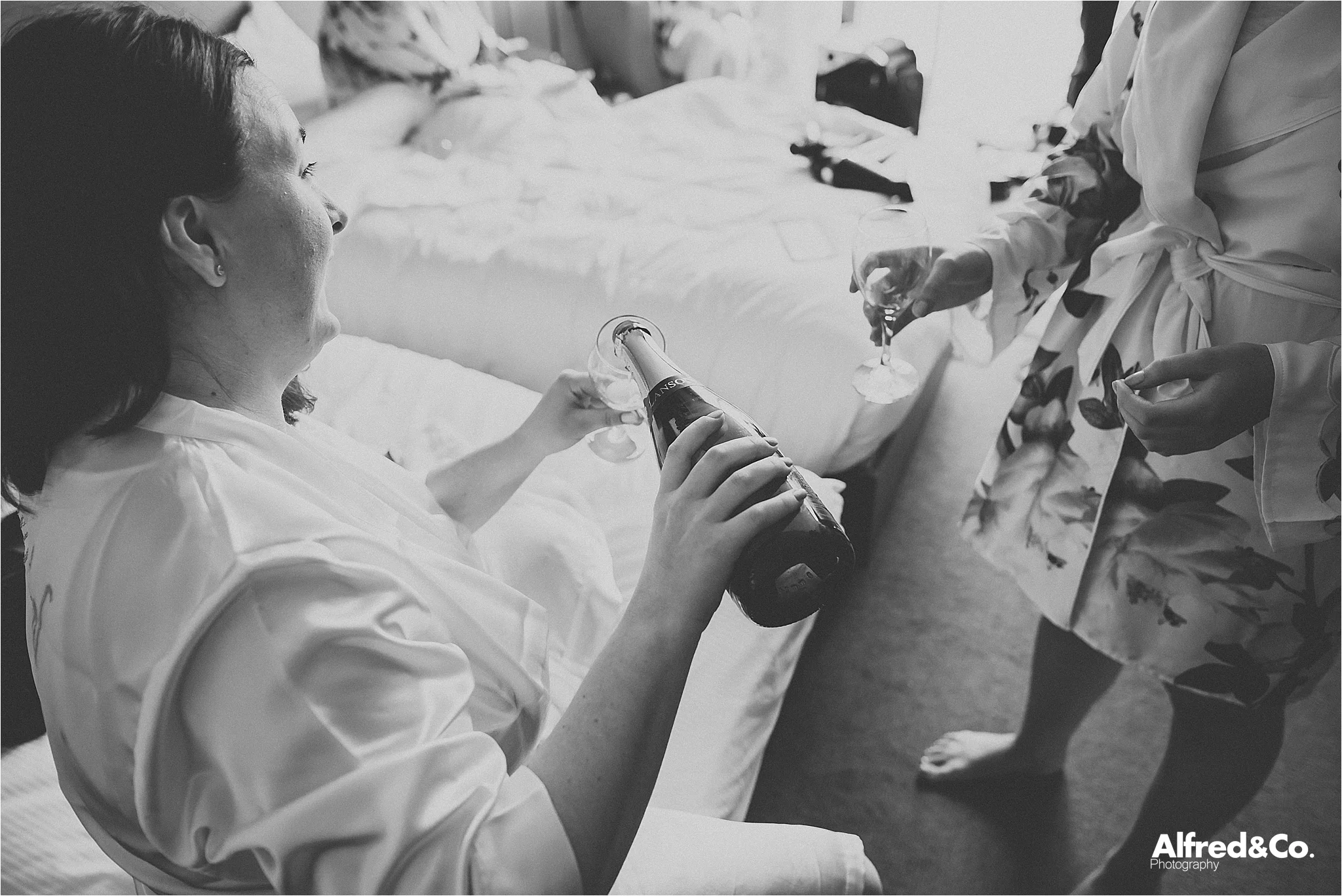 bride pouring champagne