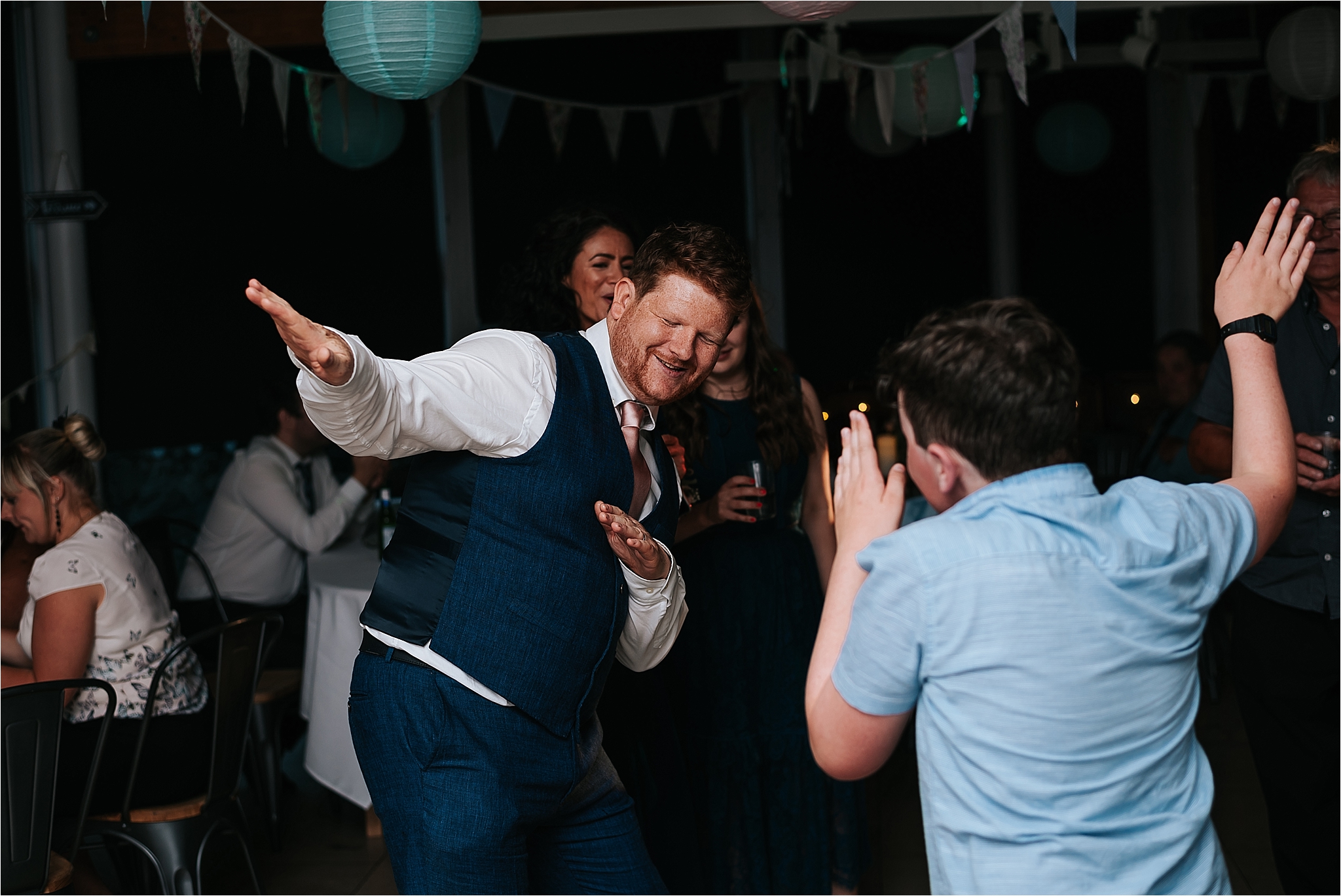 Groom dancing at wedding at the atrium