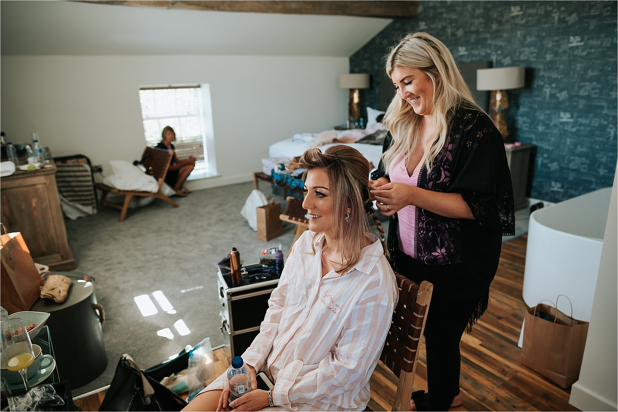 bridesmaid having her hair done at holmes mill wedding 