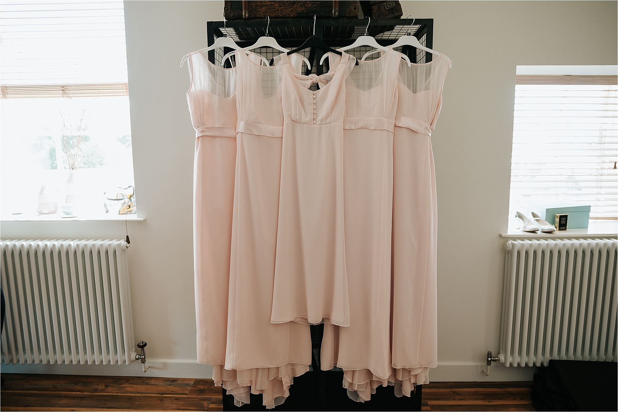 bridesmaids dresses hanging up in the penthouse at the spinning block hotel, clitheroe 
