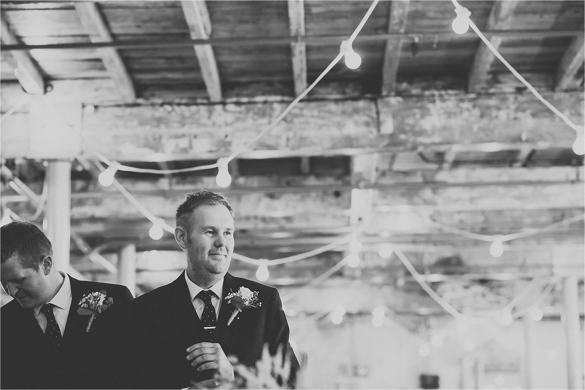 Groom in ceremony room at holmes mill, bowling brewery