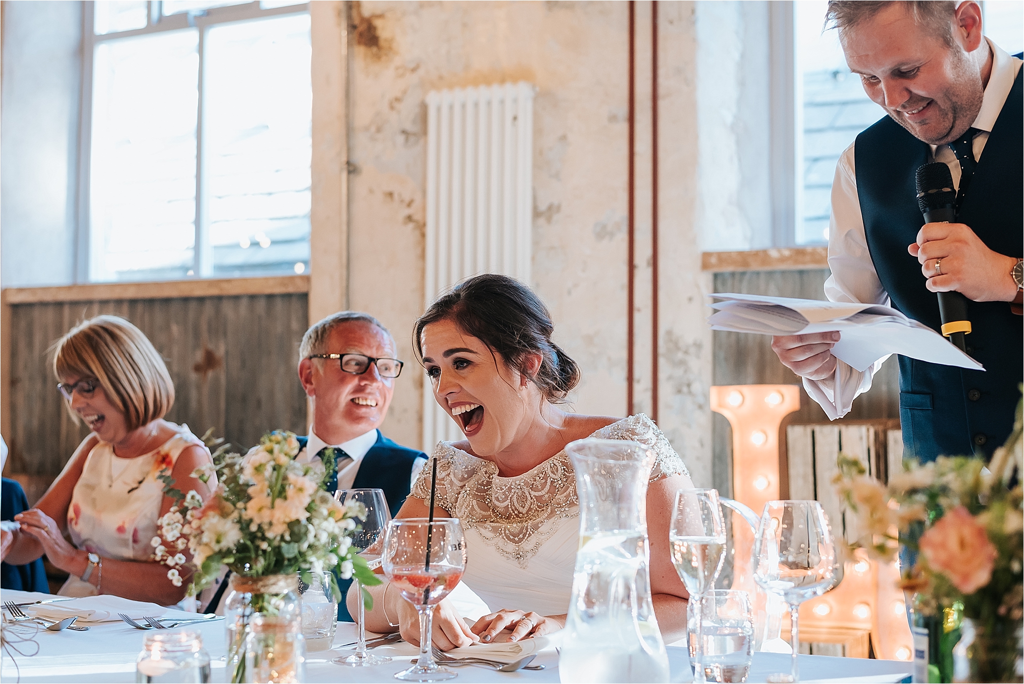 bride laughing at holmes mill wedding 