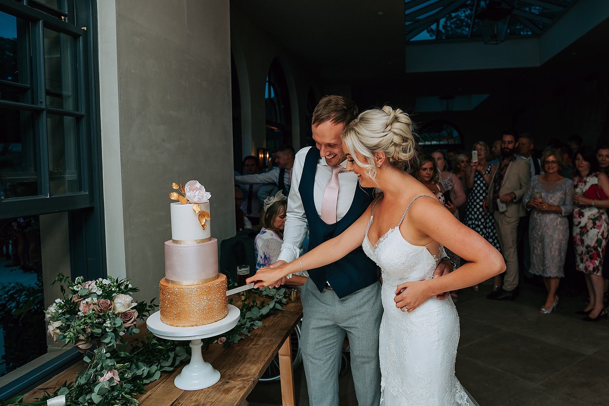 bride and groom cut their cake 