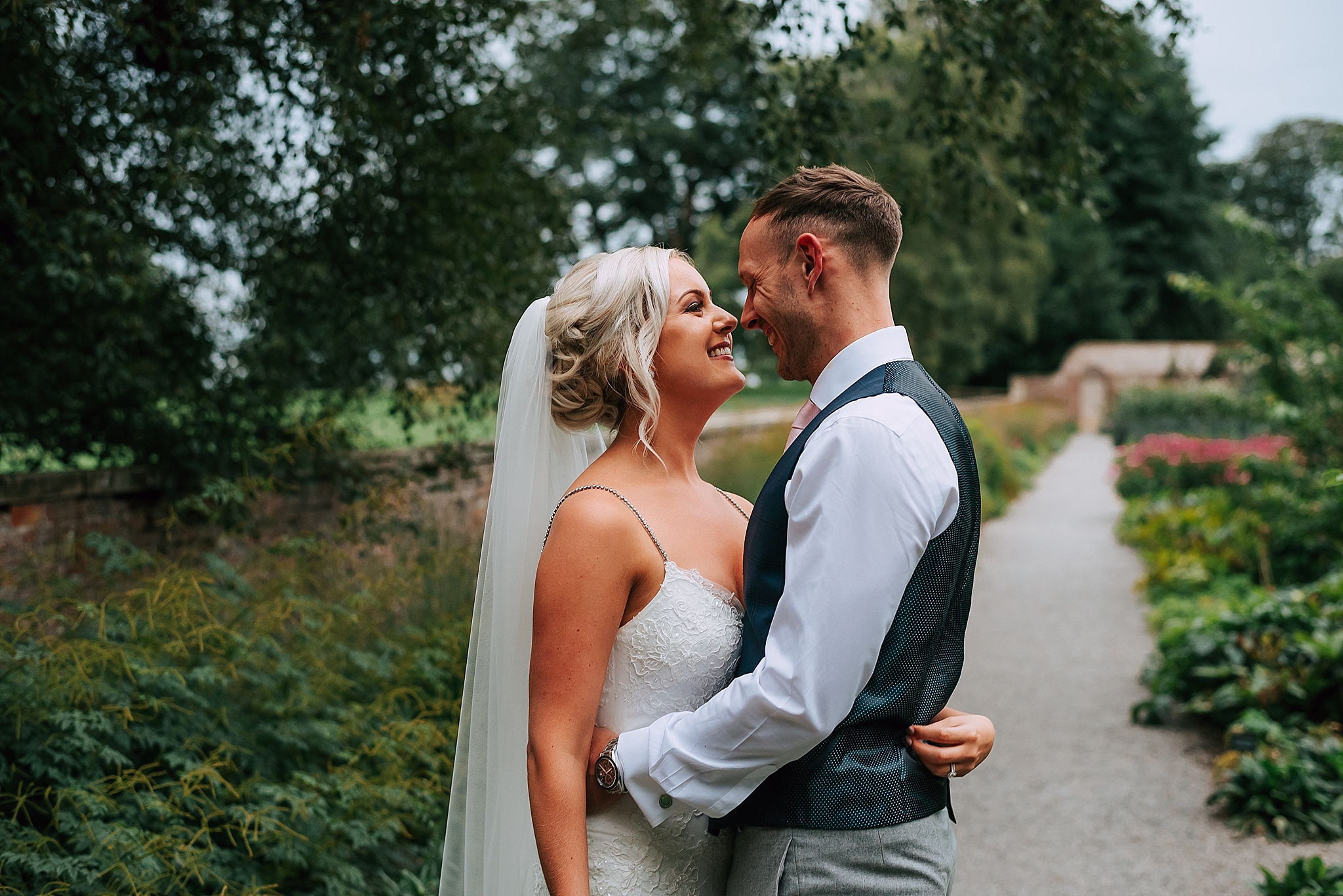 bride and groom in kitchen garden at the fig house 