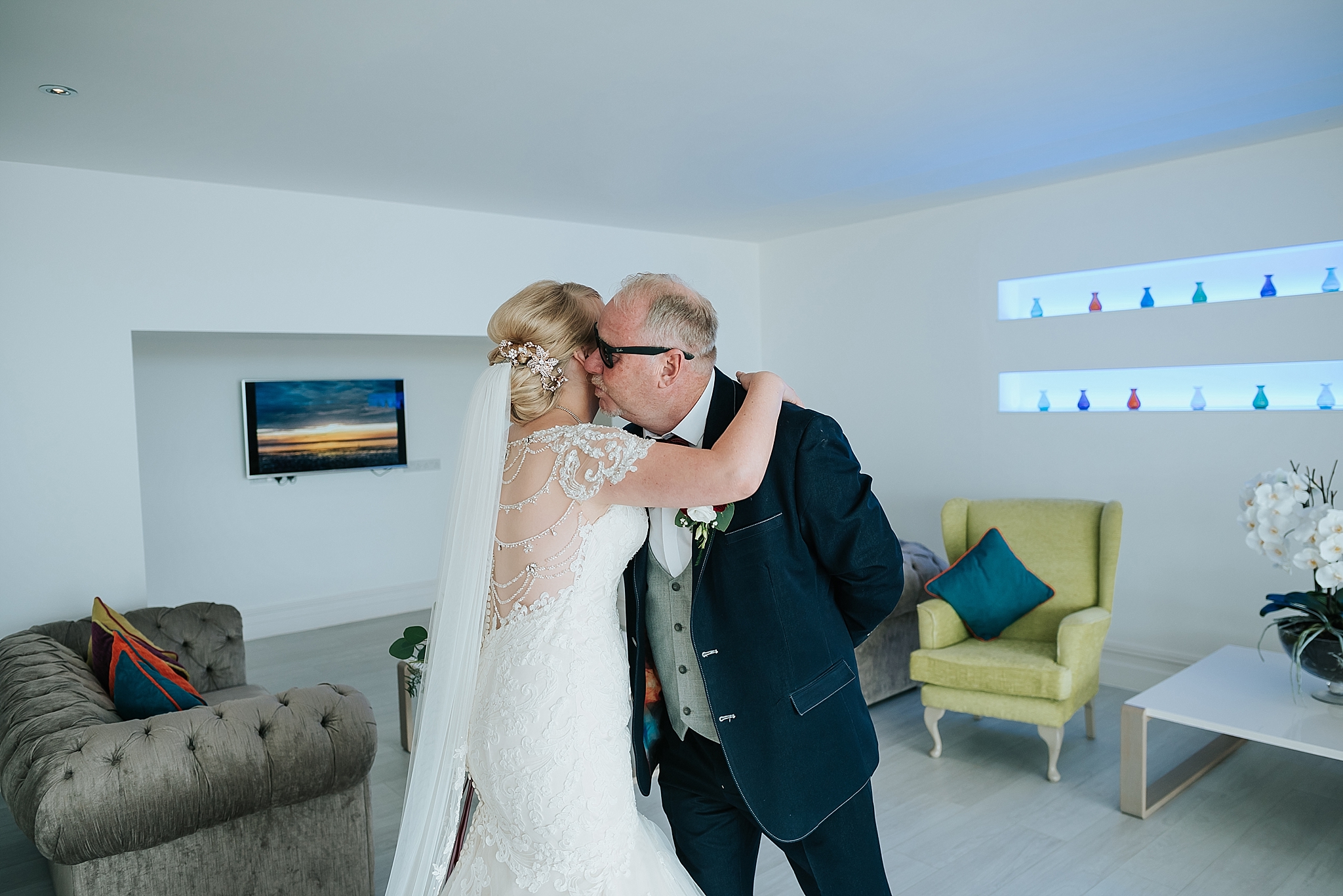 bride hugs dad before wedding at st annes palace 