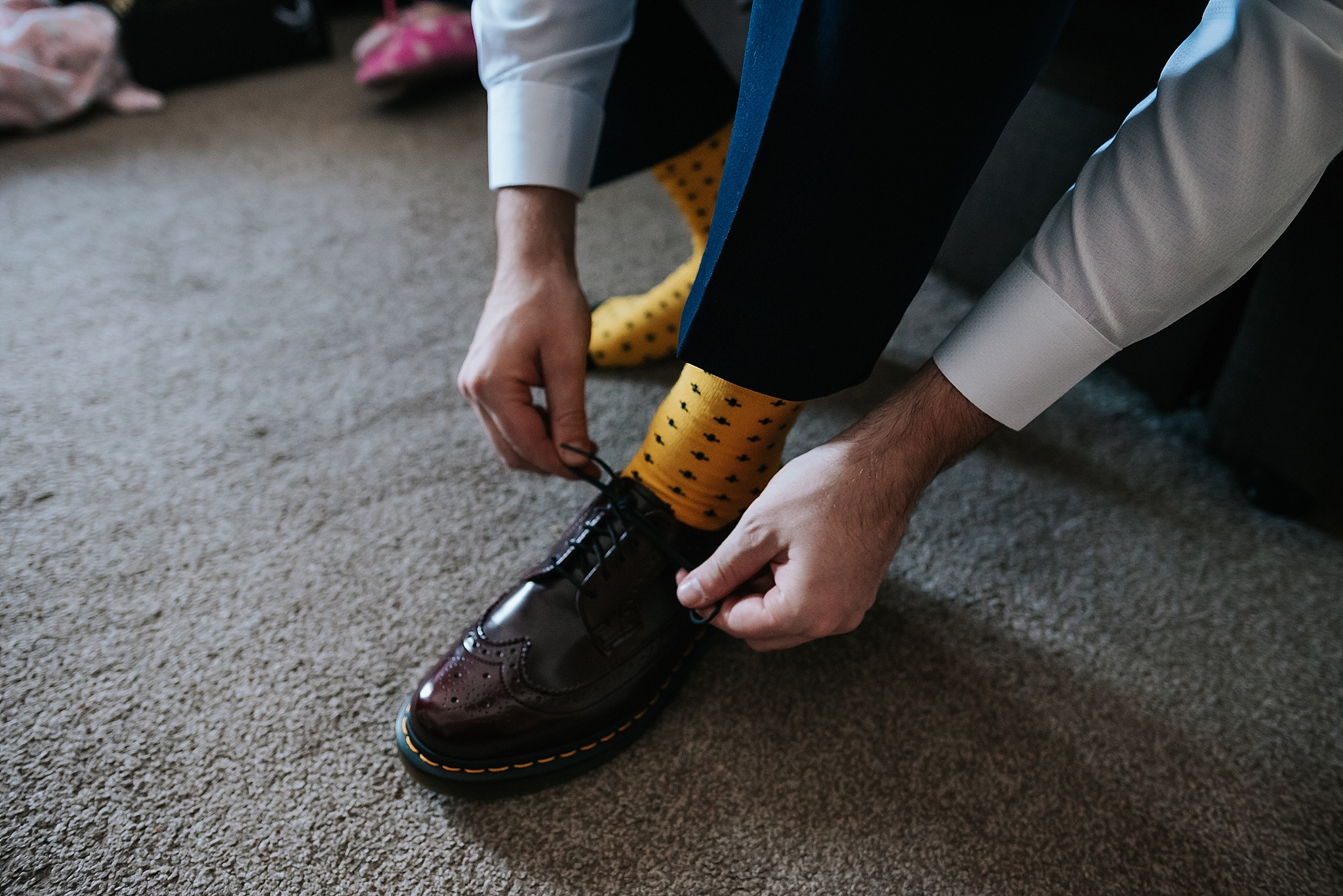 groom puts on his doc martens 