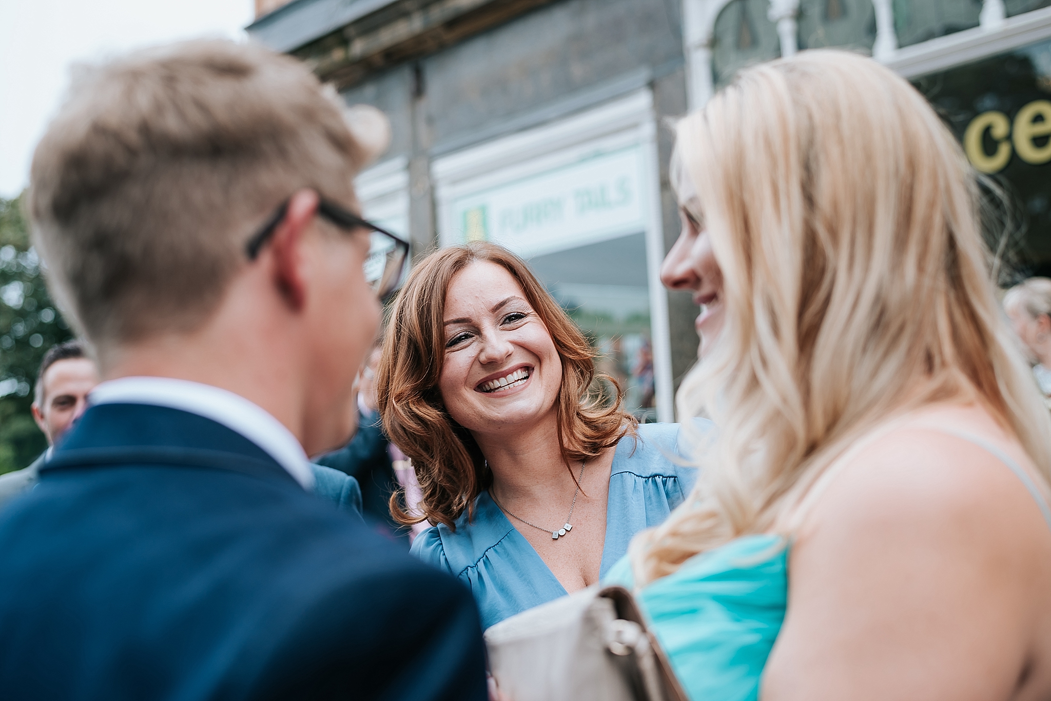 woman laughing outside st annes palace wedding venue
