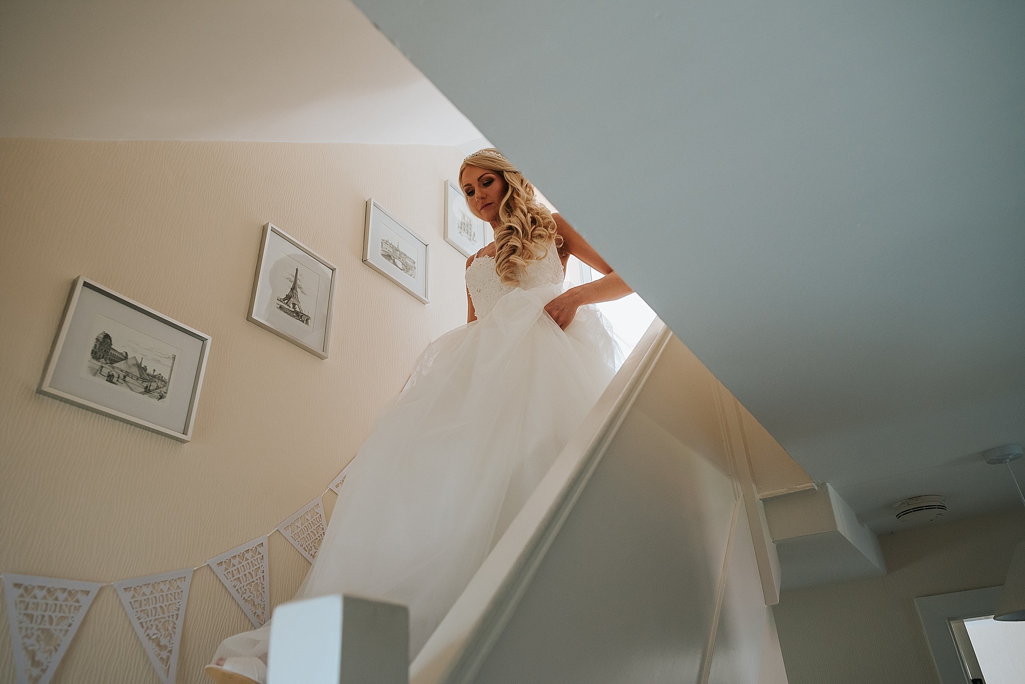 bride walking down stairs before wedding
