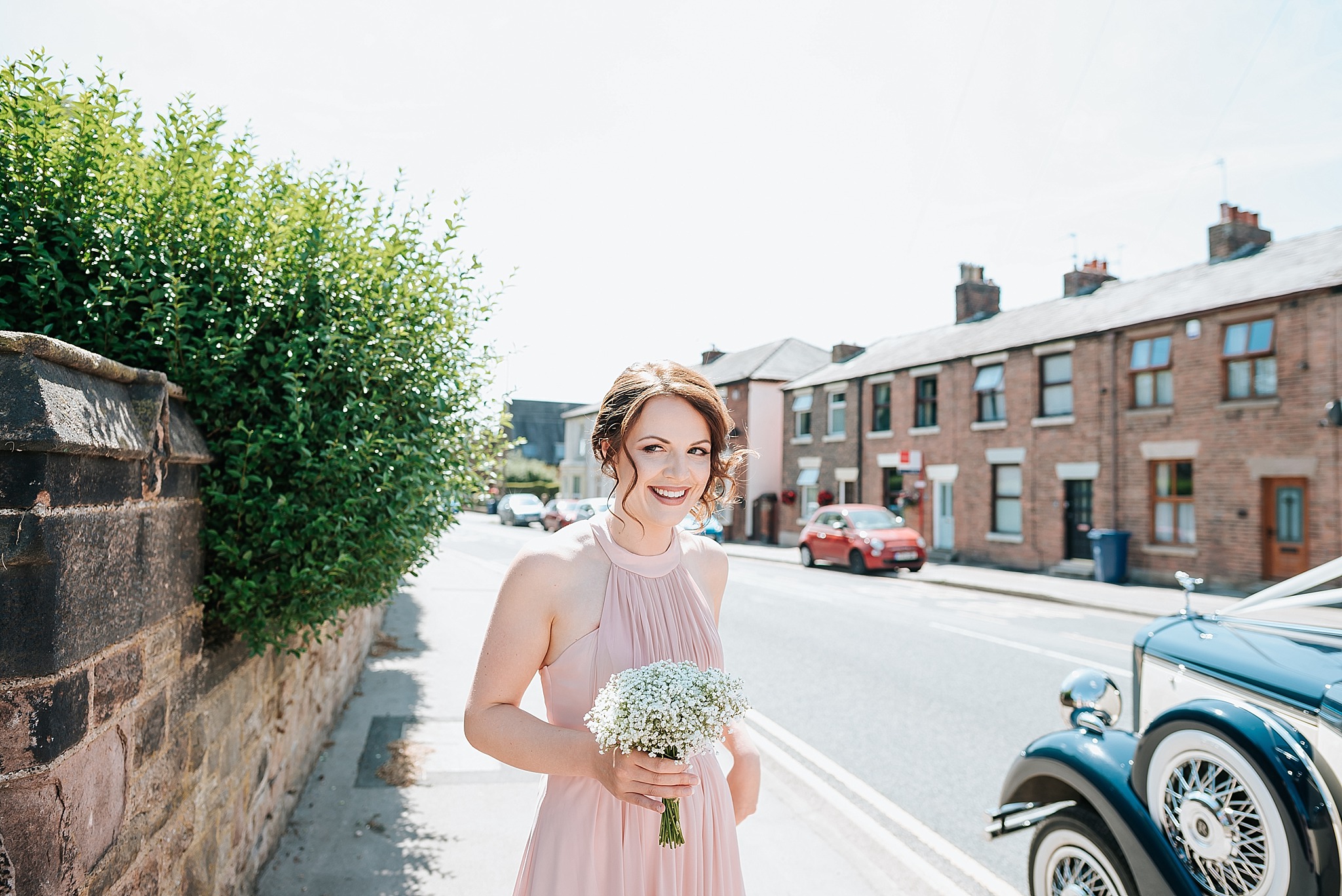 bridesmaid outside all saints church in preston 