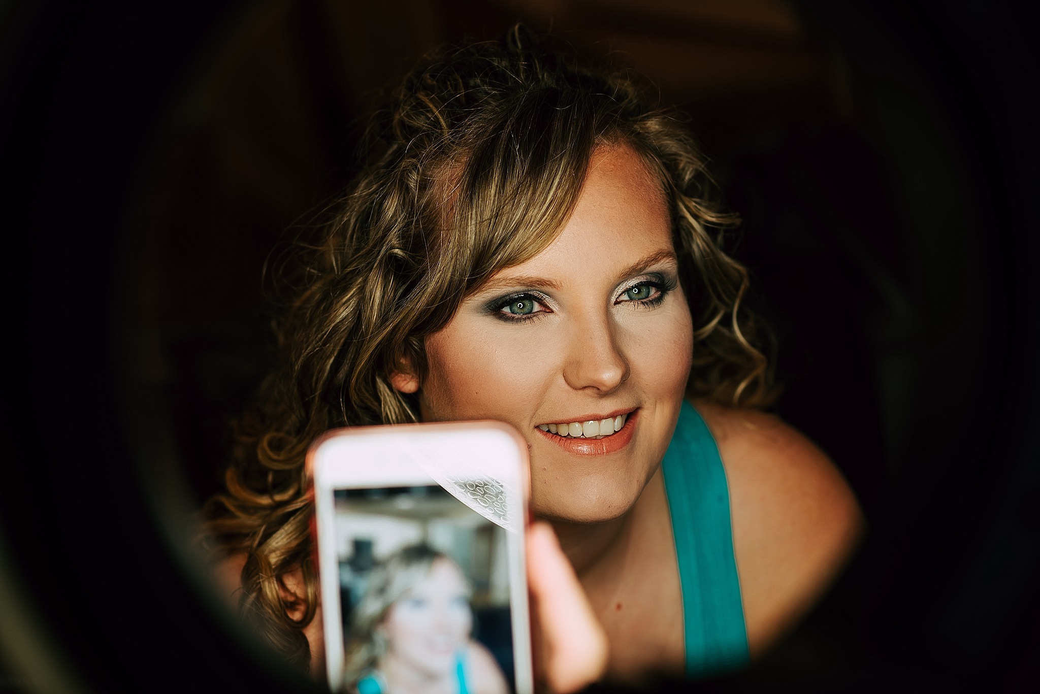 bride has make up done for wedding