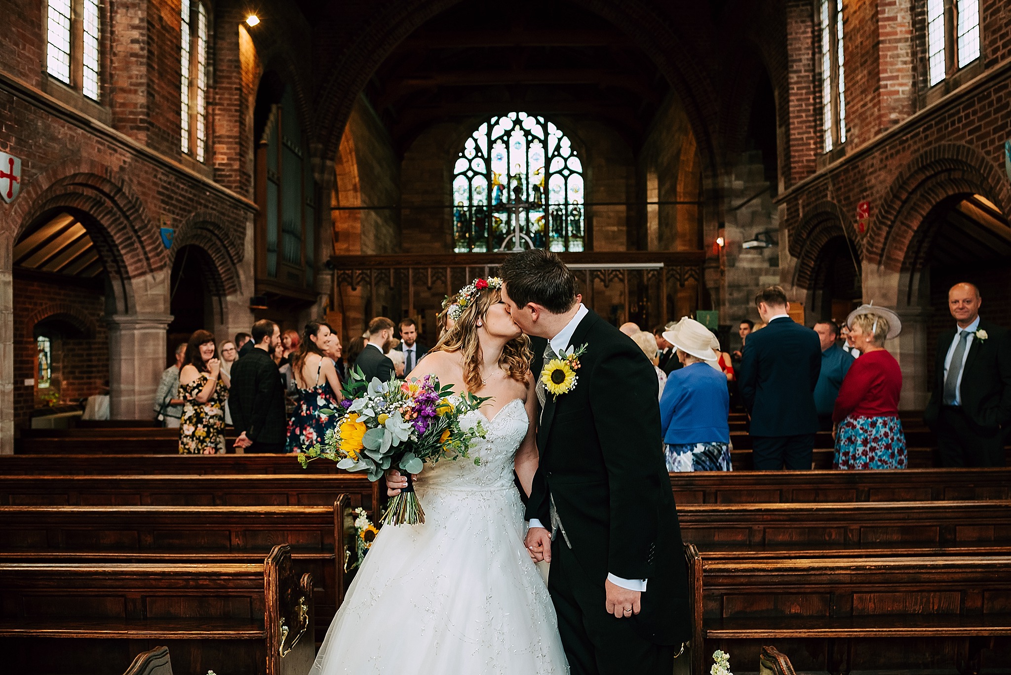 couple walk down aisle at wedding in lancashire