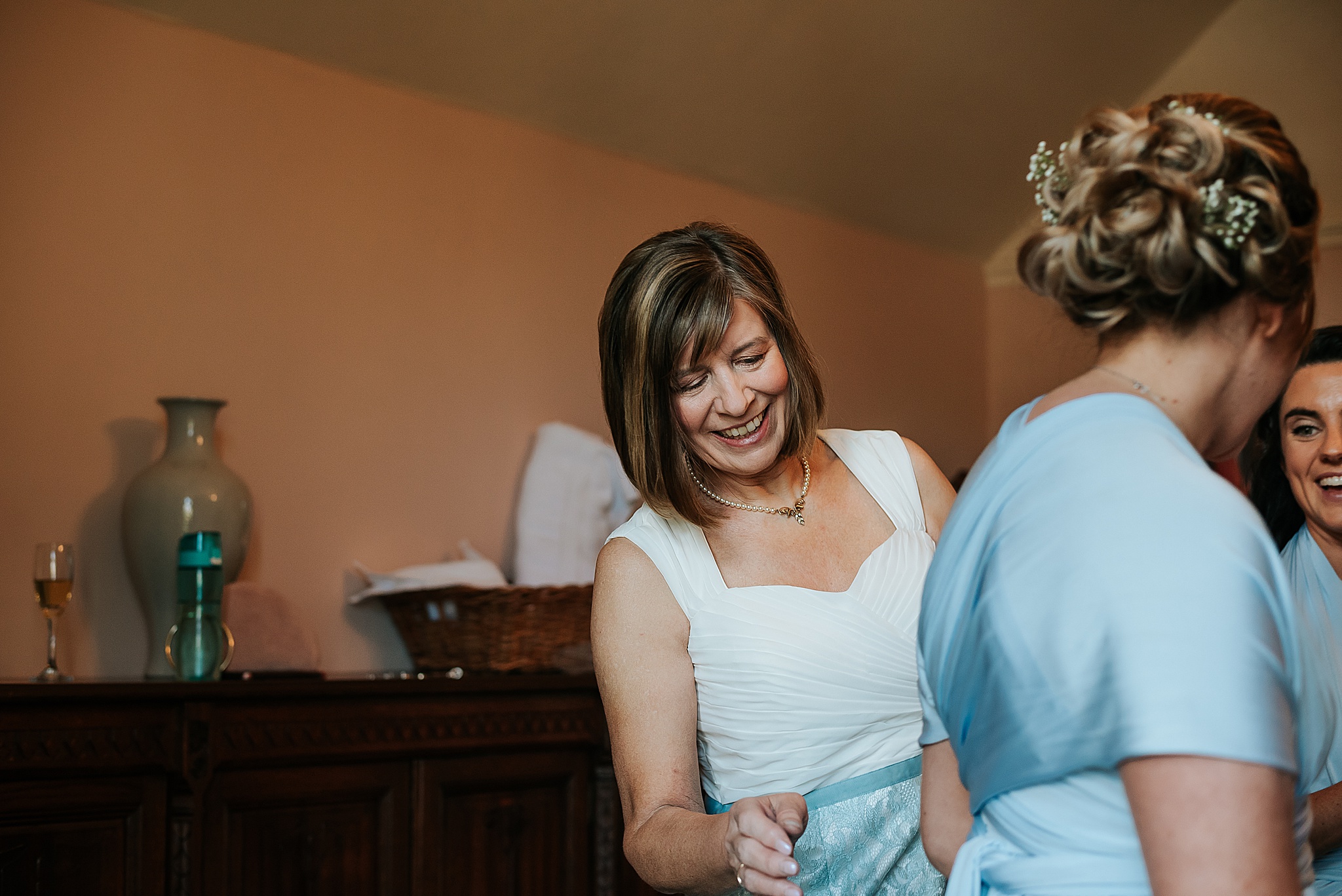 mother of the bride getting ready for wedding near preston