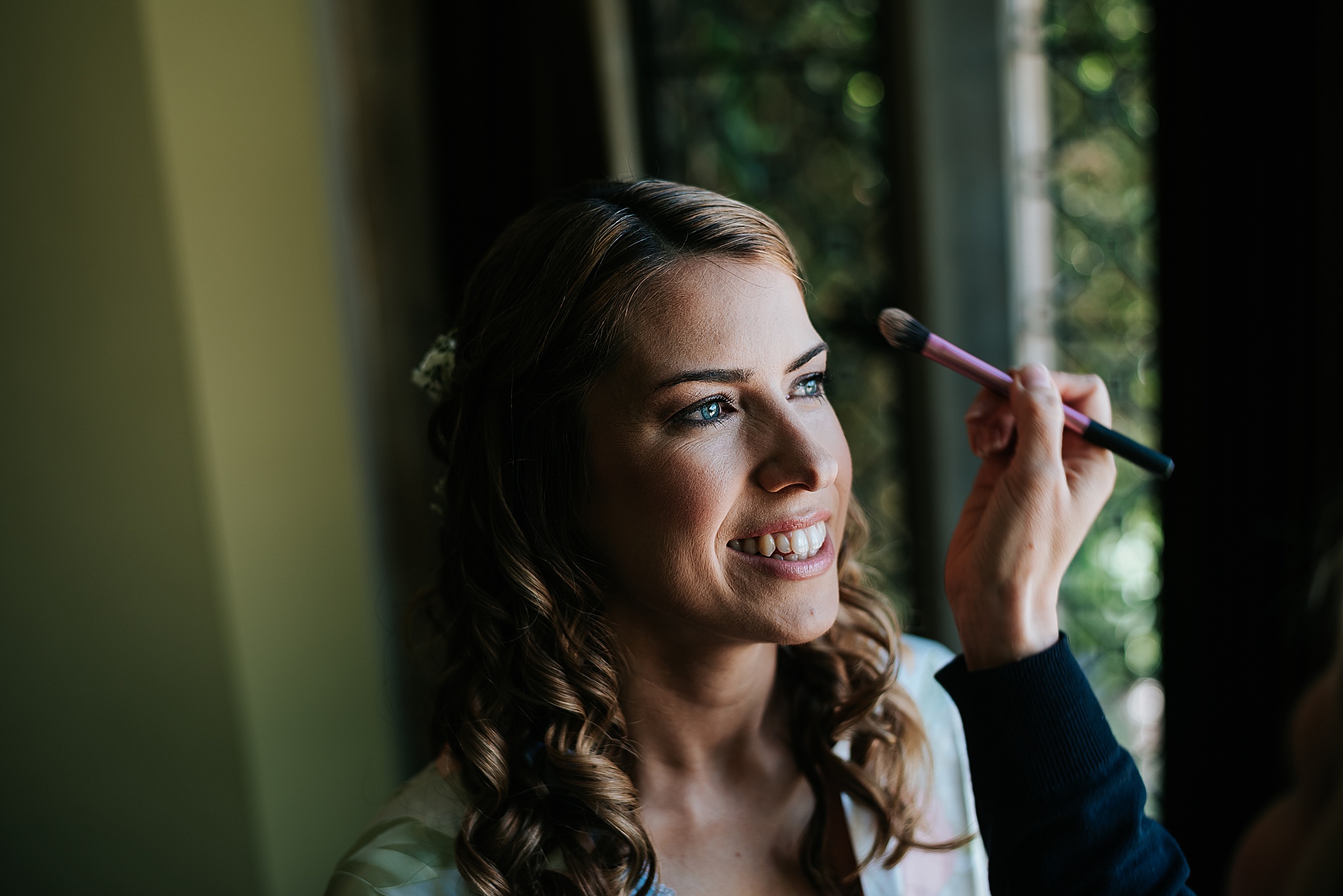 bride having her make up done 