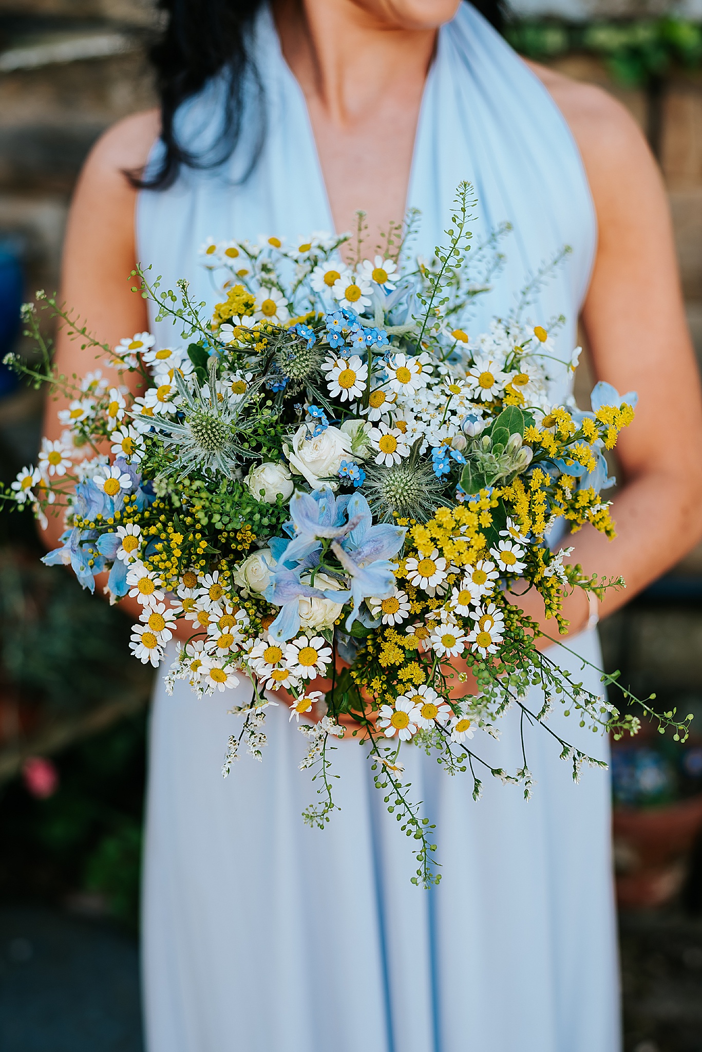 spring wedding bouquet by bluebells and daisies