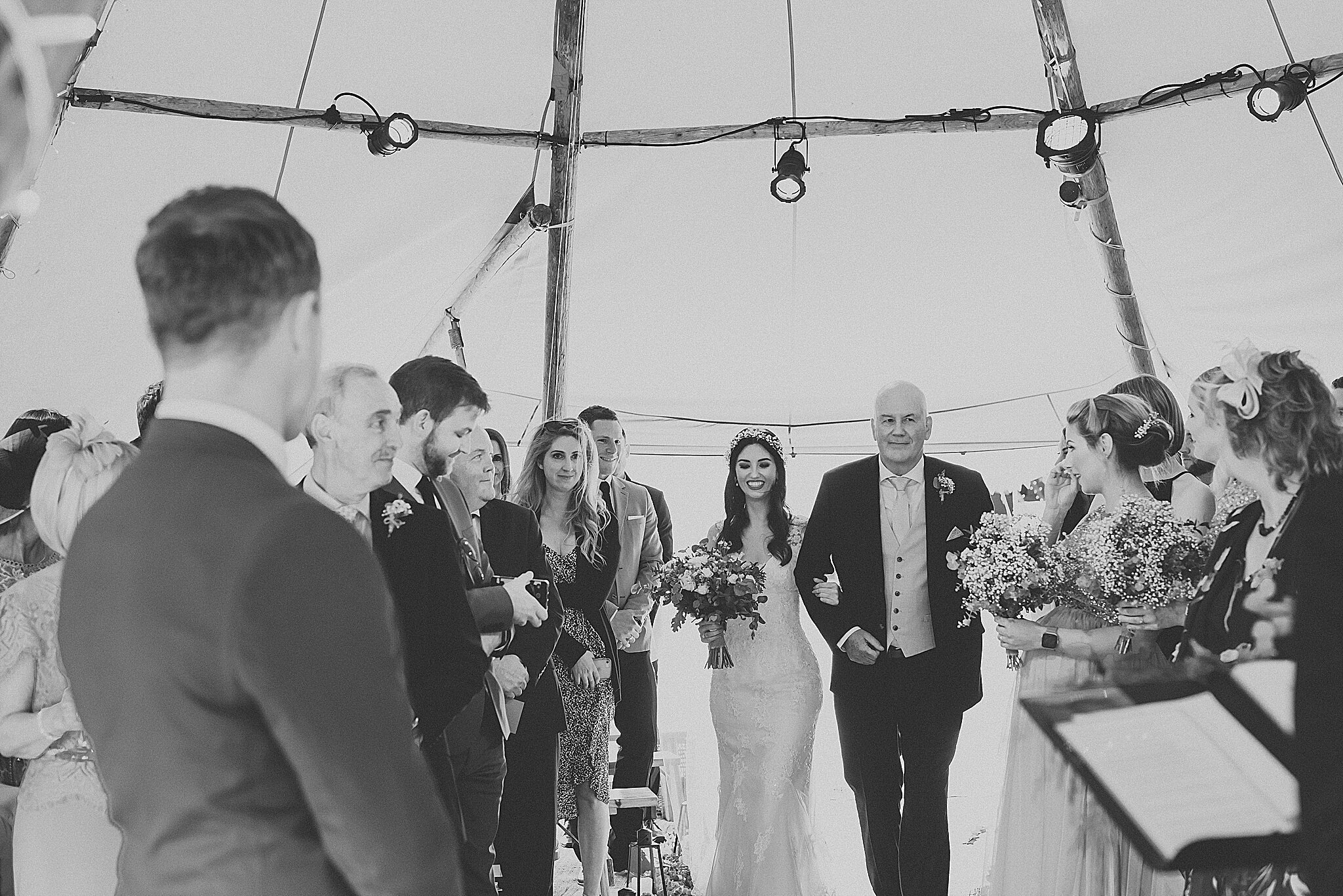 bride and groom in wedding ceremony in tipi in cheshire 