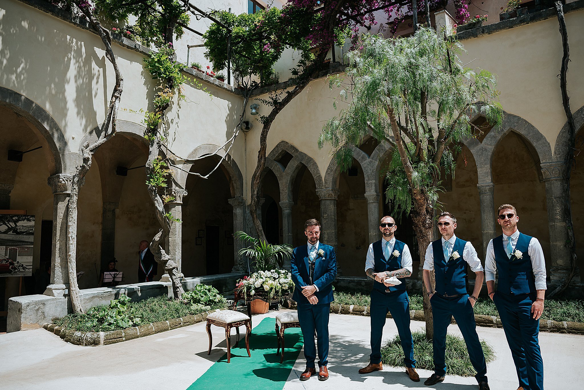 groomsmen at the cloisters in sorrento waiting for bride 