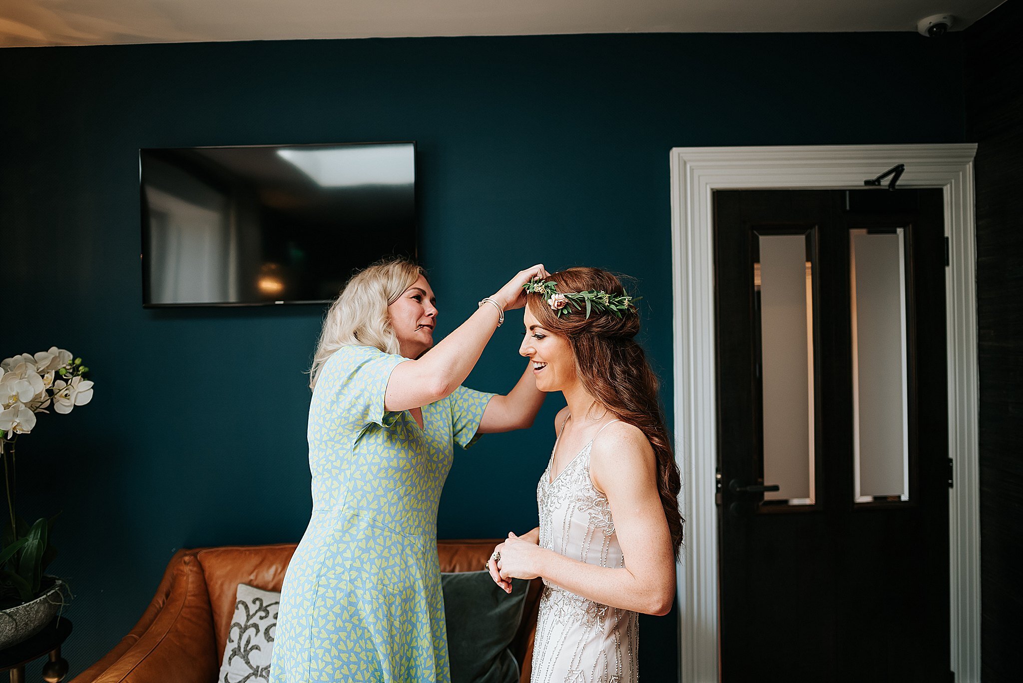 bridesmaid gets ready for wedding at the manor house 