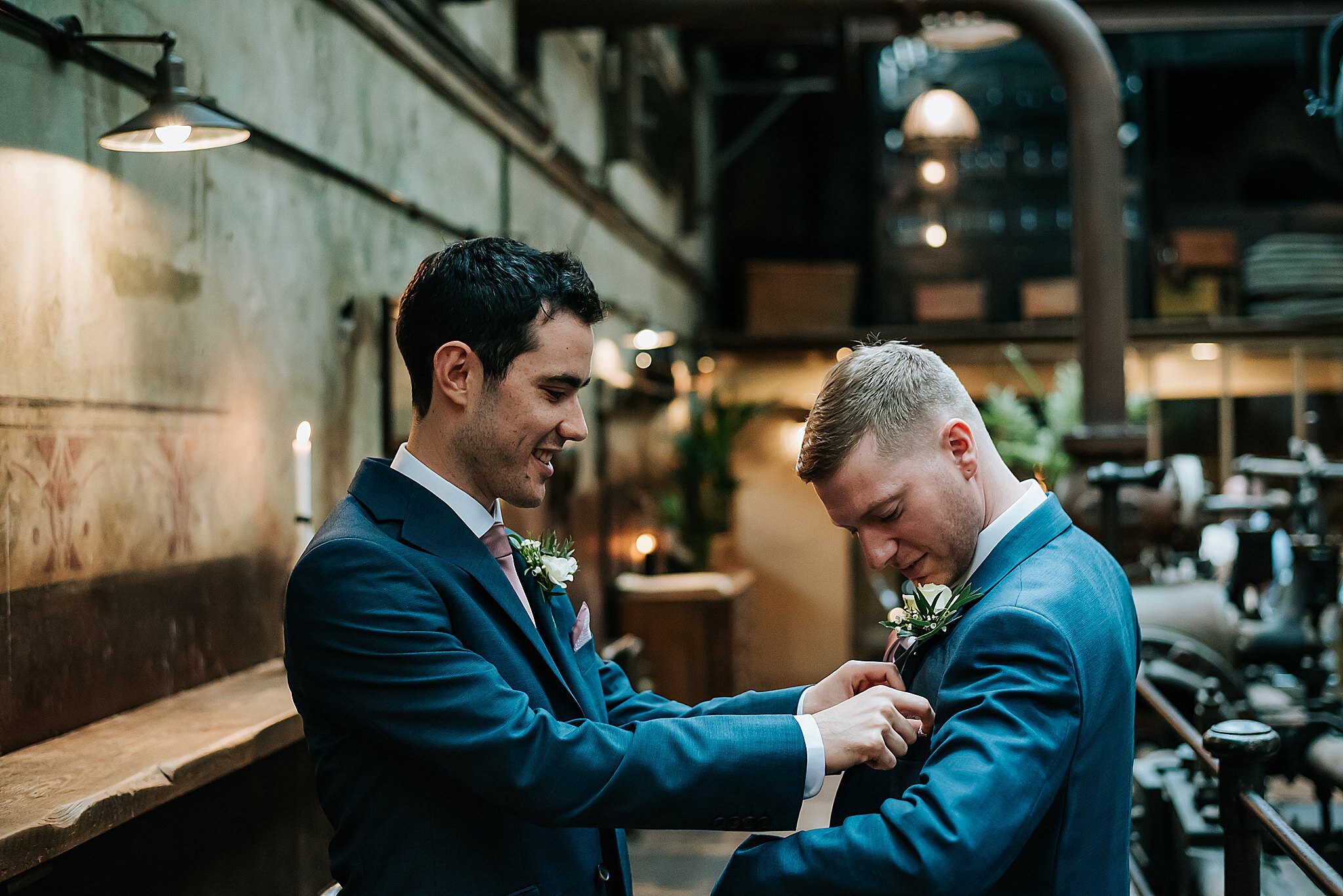 groom and best man get ready for wedding at holmes mill in the boiler room 