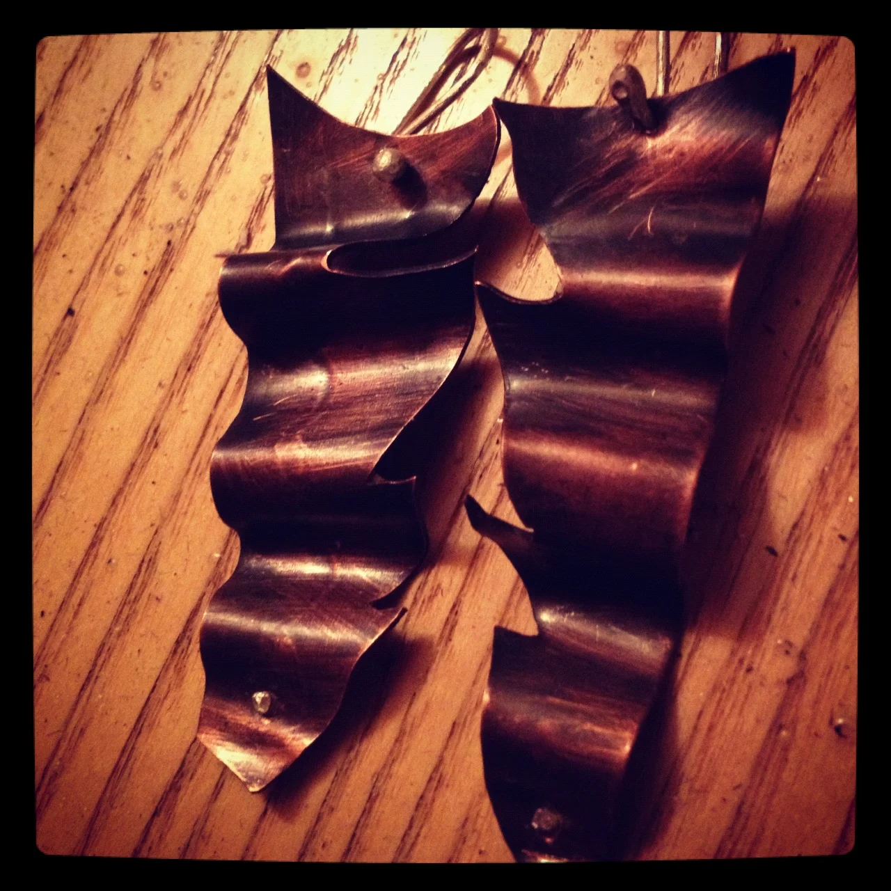 Oxidized copper ruffle with sterling silver hook