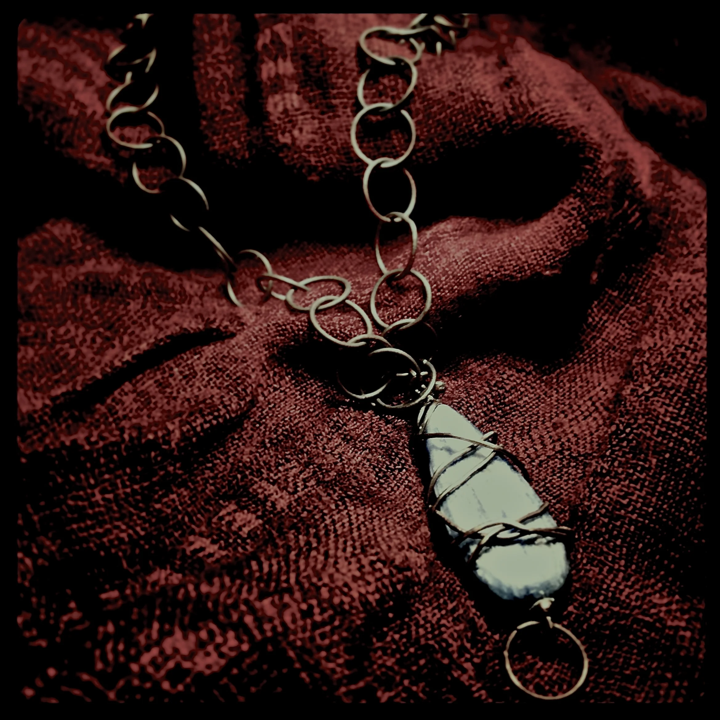 Kyanite wrapped in sterling silver with patina