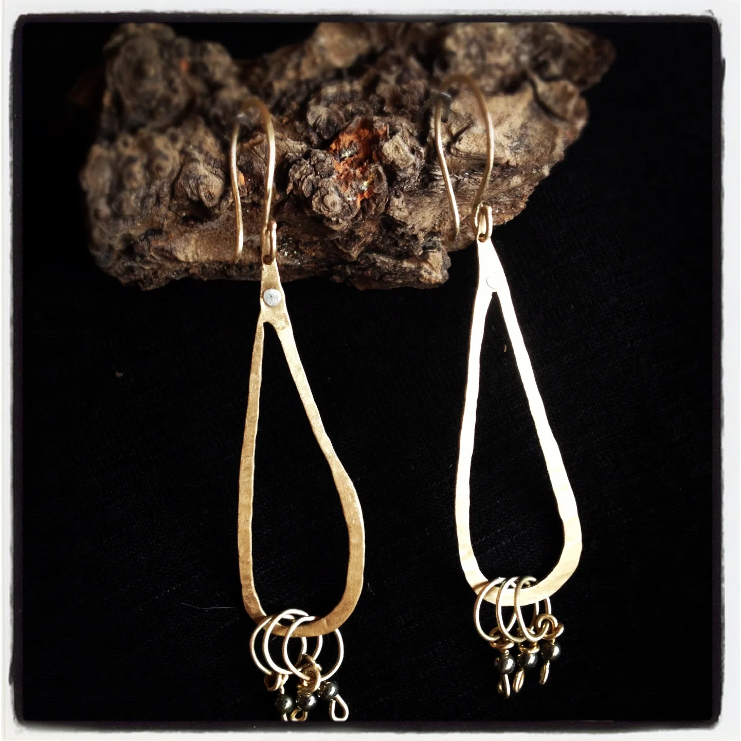 Brushed brass with sterling silver rivet and hematite dangles