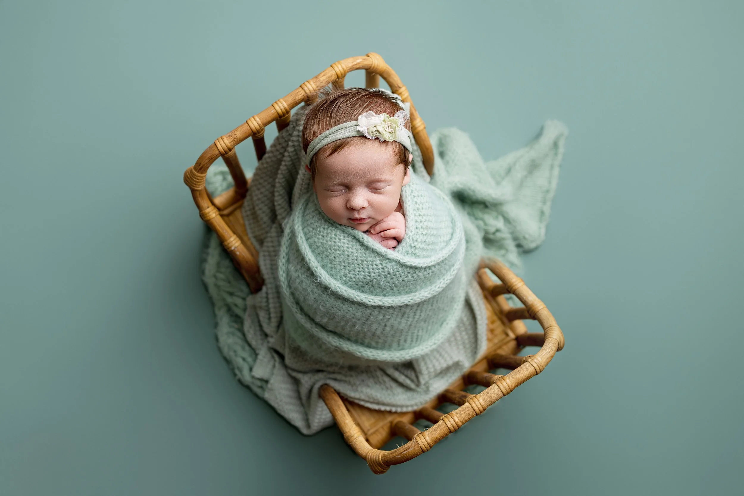 aby laying in a basket inna studio in Abingdon Maryland, newborn photographer Sweet Bliss Photography