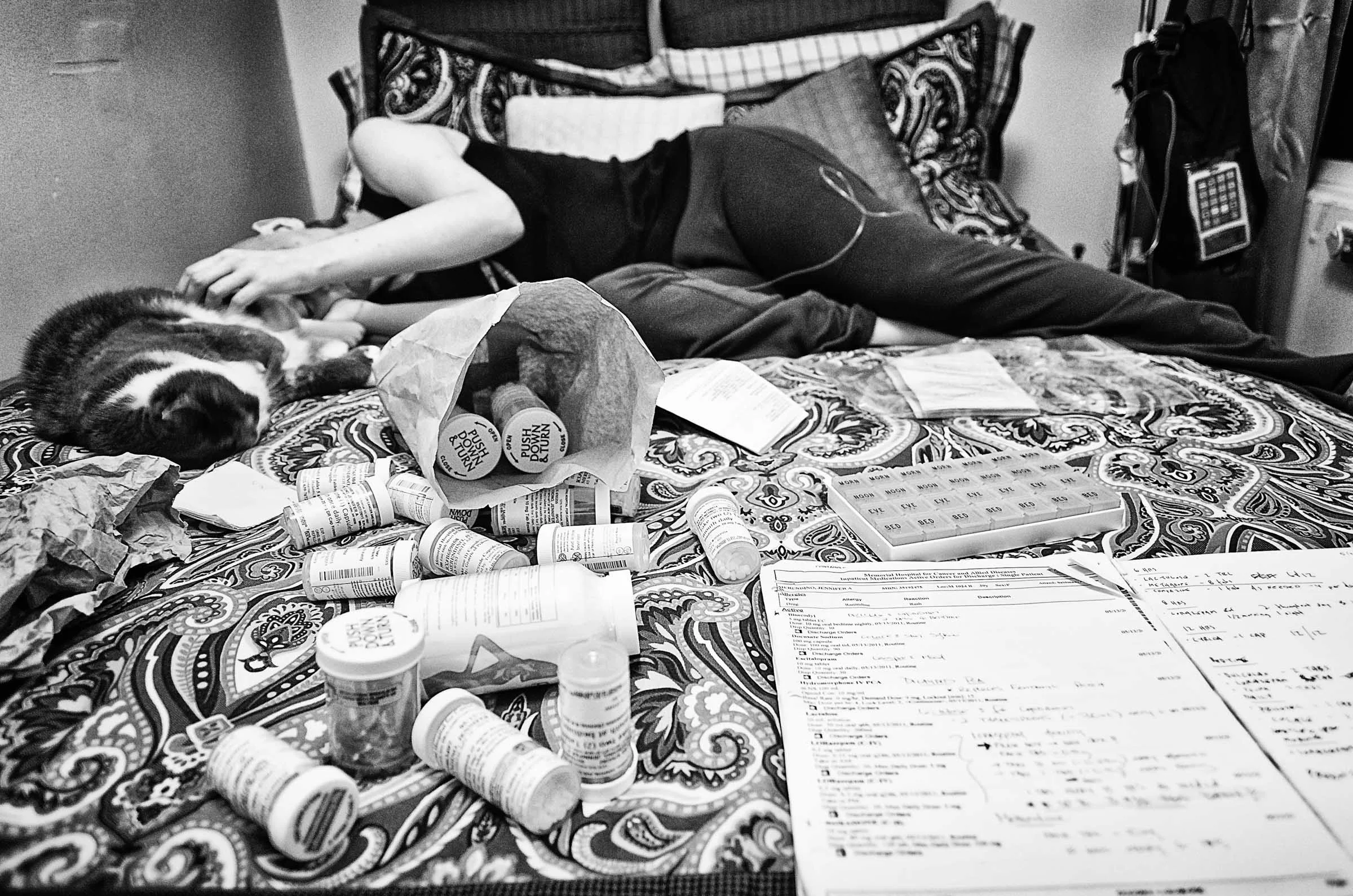 Jen rests with our cat Brea while I prepare her daily pill regimen.