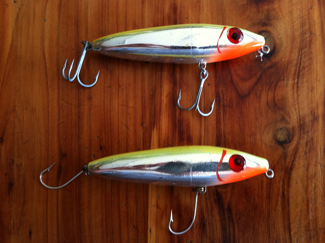 Before and after, top plug has the old treble hooks, six total points to penetrate the fish, as opposed to the bottom plug which has converted to single hooks.