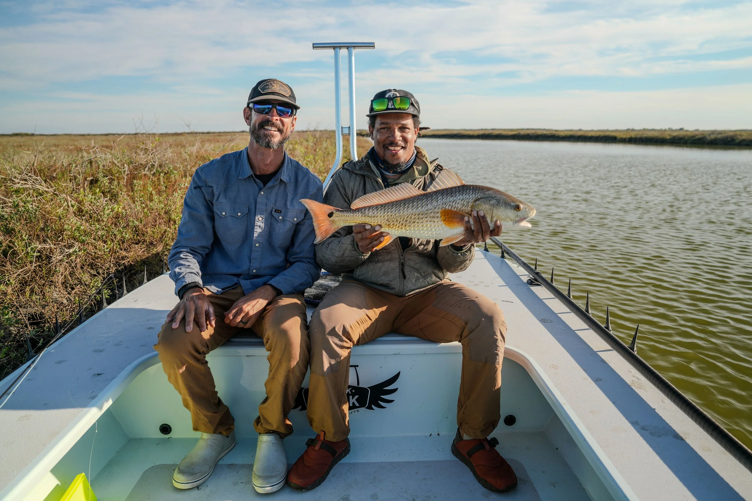 Alvin Dedeaux and an angler with a redfish on the Texas coast