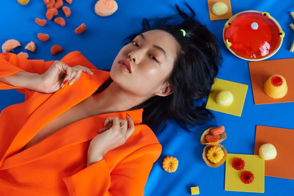 Woman in orange jacket photographed by Philadelphia Photographer Justus Henry