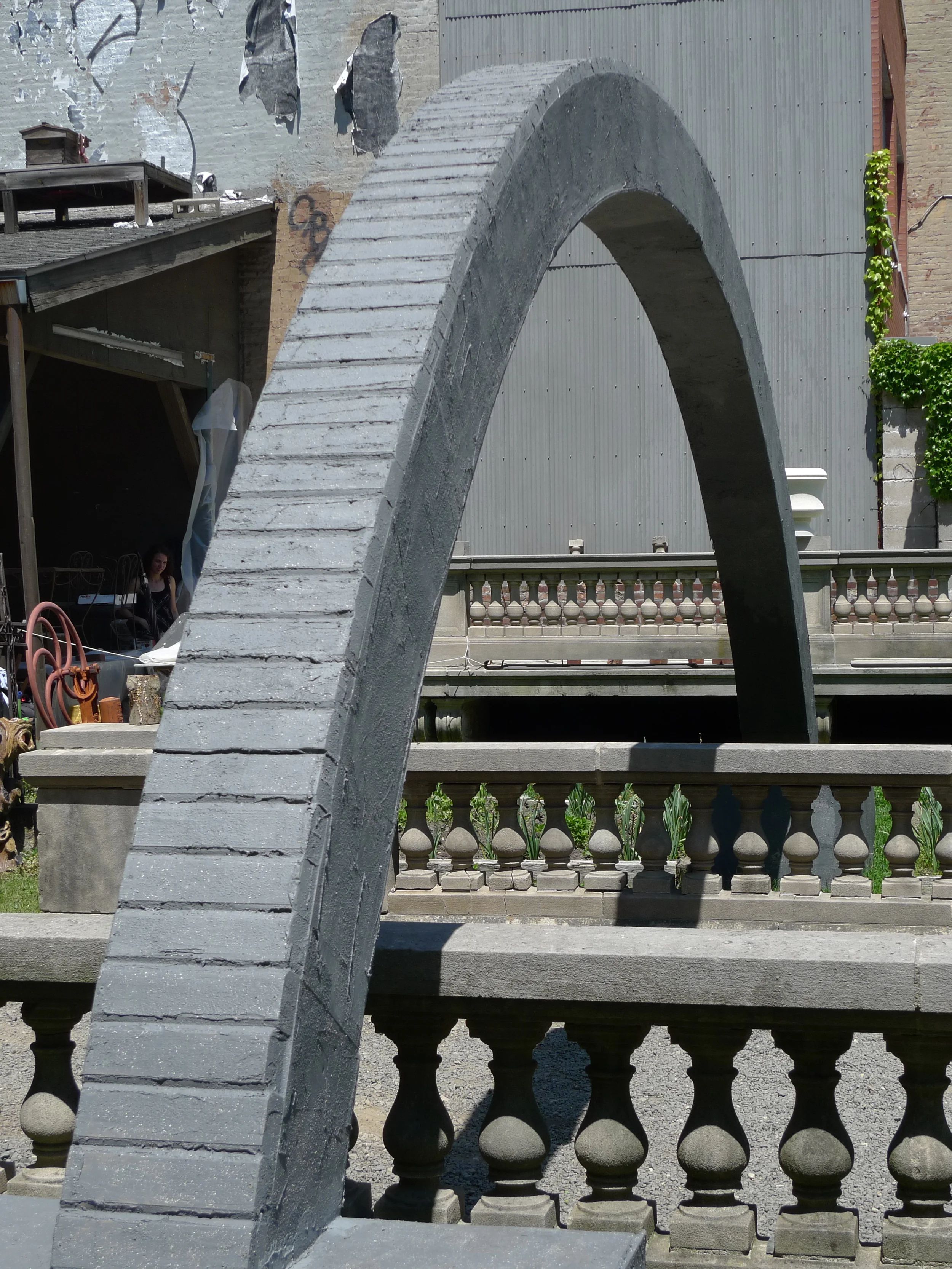   Hold Me in Your Long Arms . Detail view. 25' long x 10' tall. Treated lumber, hardware, rebar, sandbags, vortex anchors, cable, elastomeric compound, iron oxide. 2014. 