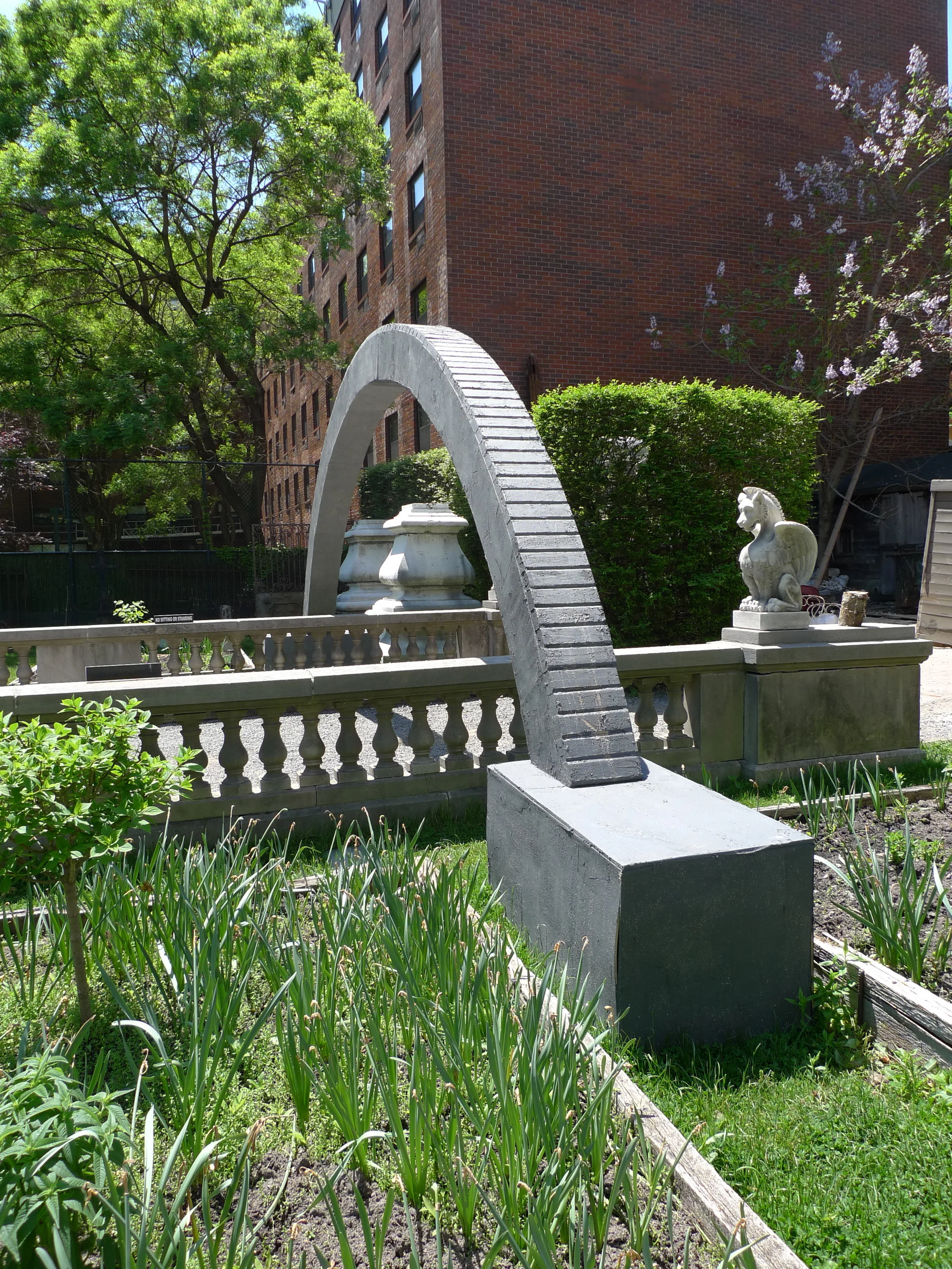   Hold Me in Your Long Arms . Detail view. 25' long x 10' tall. Treated lumber, hardware, rebar, sandbags, vortex anchors, cable, elastomeric compound, iron oxide. 2014. 