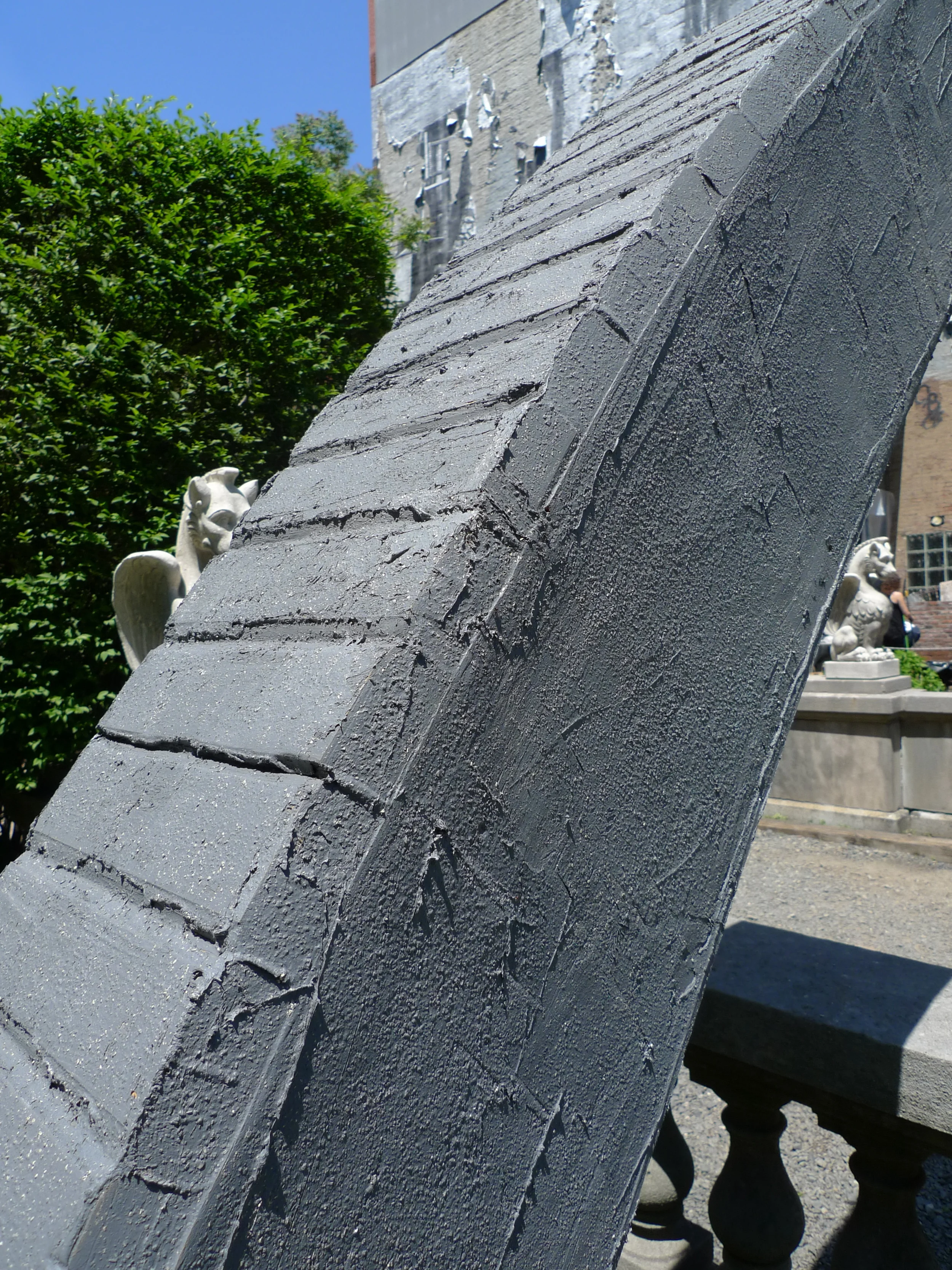   Hold Me in Your Long Arms . Detail view. 25' long x 10' tall. Treated lumber, hardware, rebar, sandbags, vortex anchors, cable, elastomeric compound, iron oxide. 2014. 