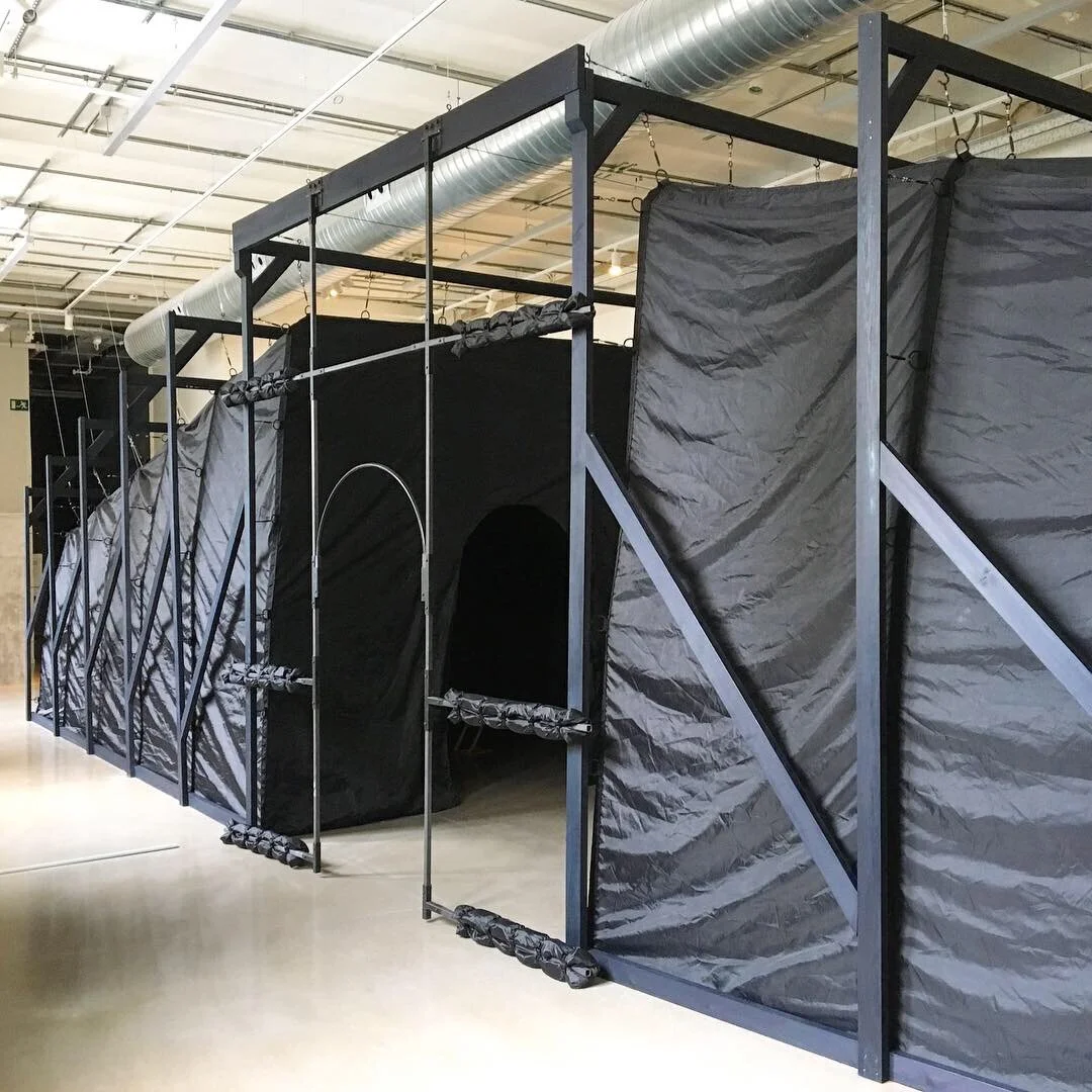   The Stranger , 2018-19. Wood, dye, wax, hardware, tent fabric, webbing, rubberized hardware (d-rings, eyelets, hooks, turnbuckles), airline cable and ferrules, steel, foam, buckles, hinges, clevis pins, cotter pins, and custom telescoping fittings.