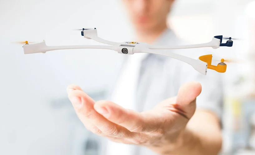 Nixie is a tiny wearable camera on a wrist band. The wrist straps unfold to create a quadcopter that flies, takes photos or video, then comes back to you.
