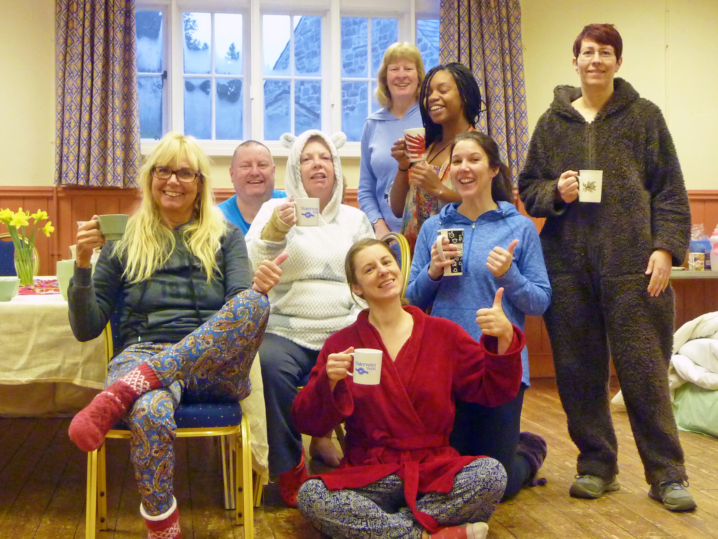 Here we all are in our PJ's and onesies... having just woken up, drinking mugs of hot lemon and ginger water before morning yoga! ha ha