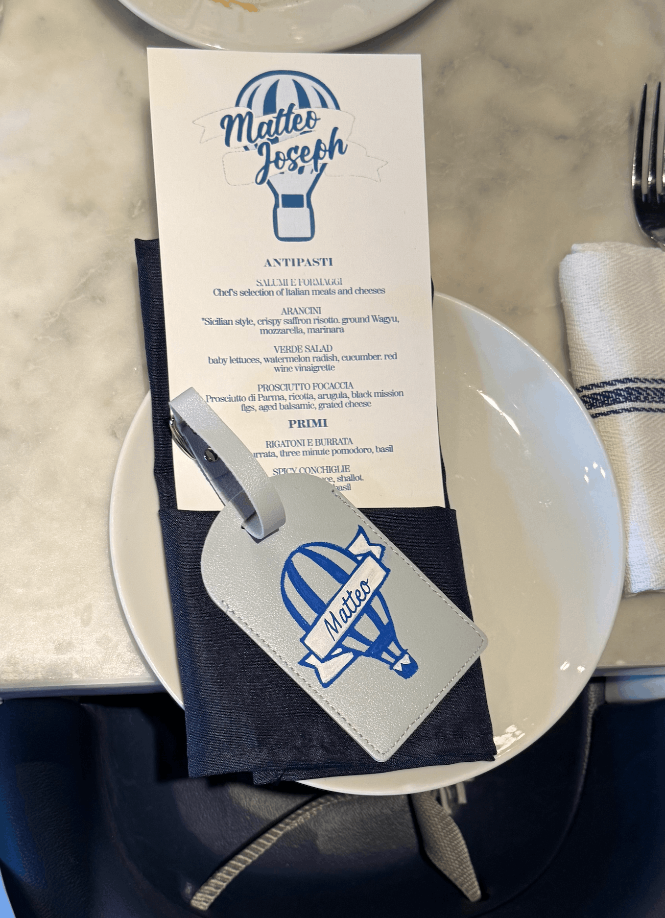 Live illustration setup with custom watercolor artwork and products for guest personalization at an event.