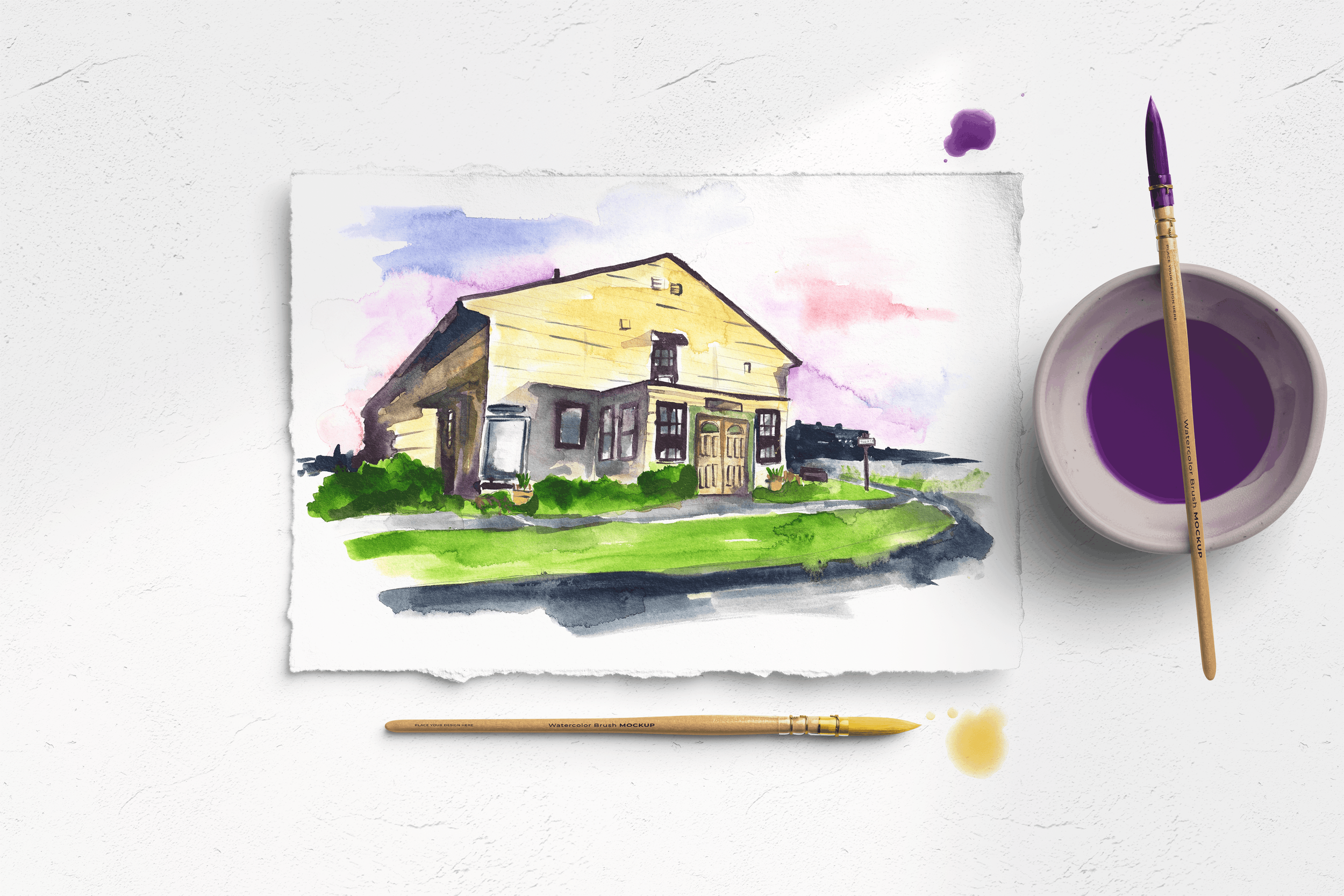 Custom watercolor house portrait of a yellow farmhouse-style home with a landscaped front yard, by Danielle Rose Fisher — shown as a fine art print with watercolor brushes and paint