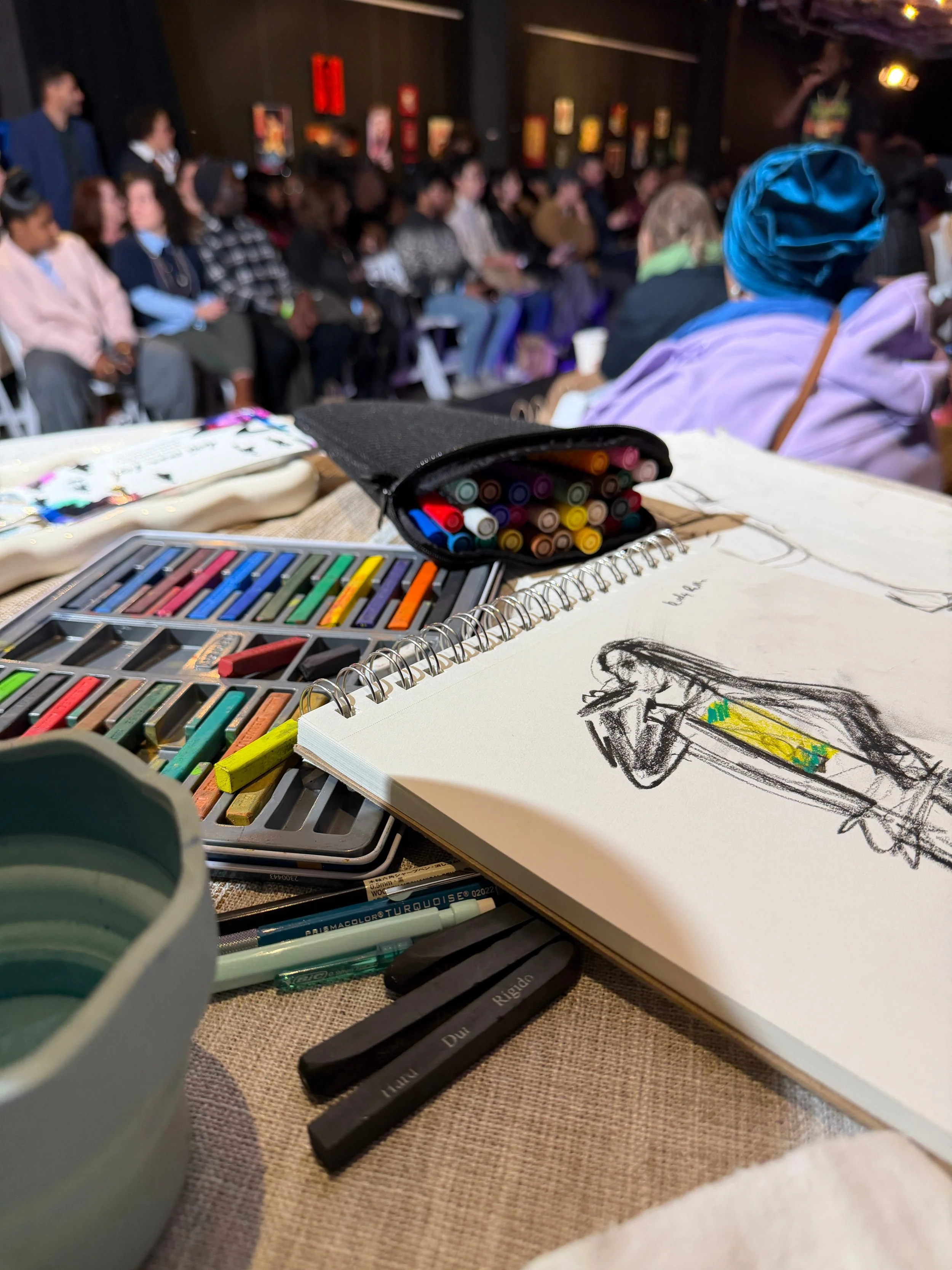 Danielles desk live drawing at a fashion runway show