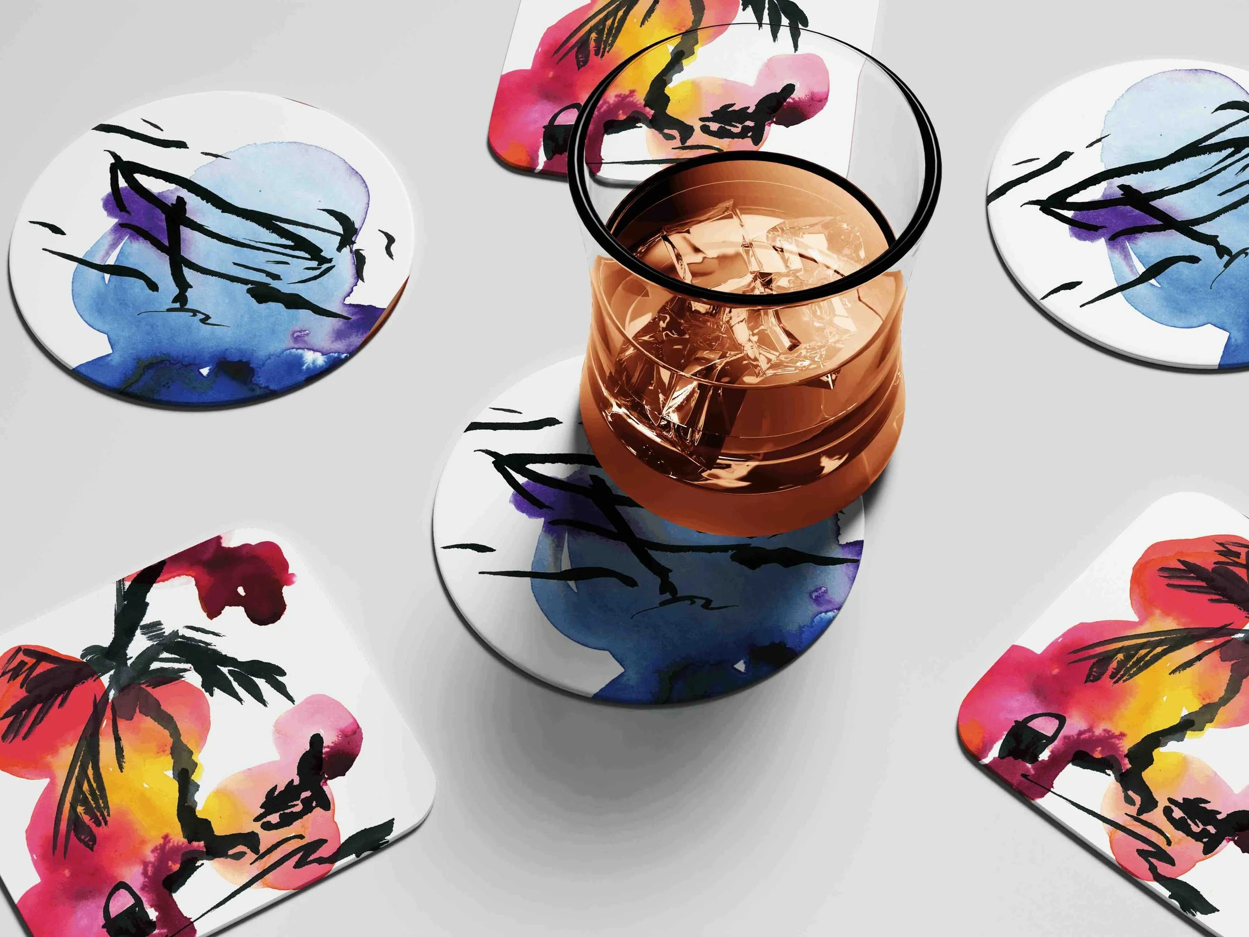 Watercolor illustrated coasters featuring a tropical parrot and botanical design — live product customization concept by Danielle Rose Fisher NYC